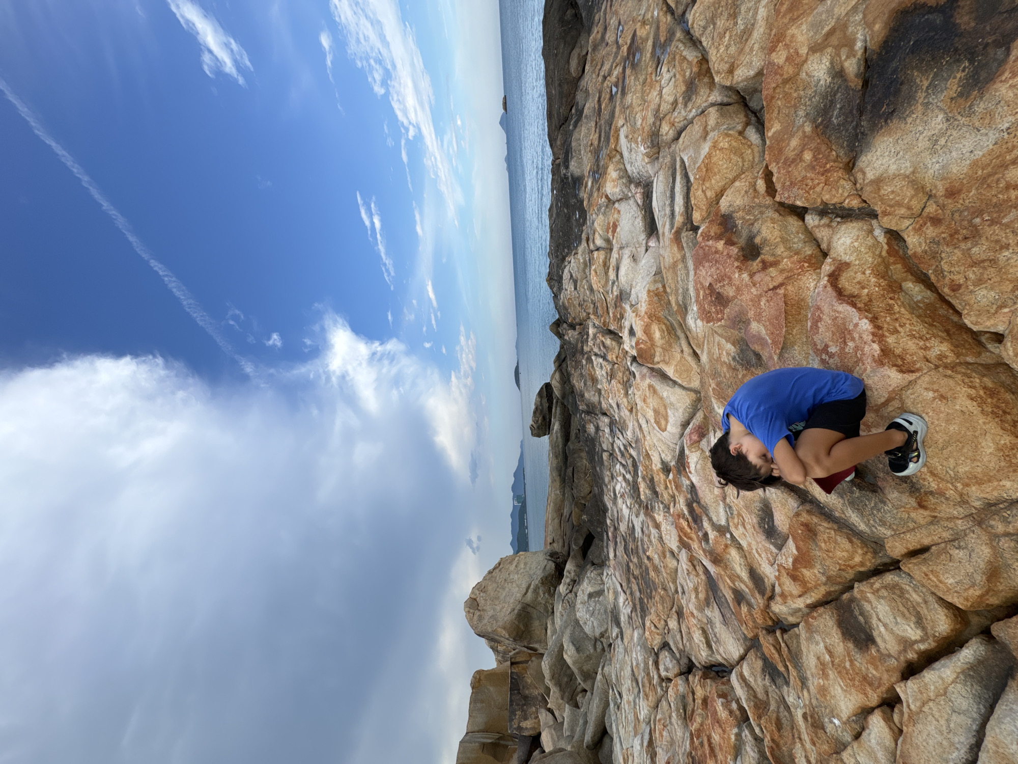 Coastal rocks and a roadside altar in Nha Trang