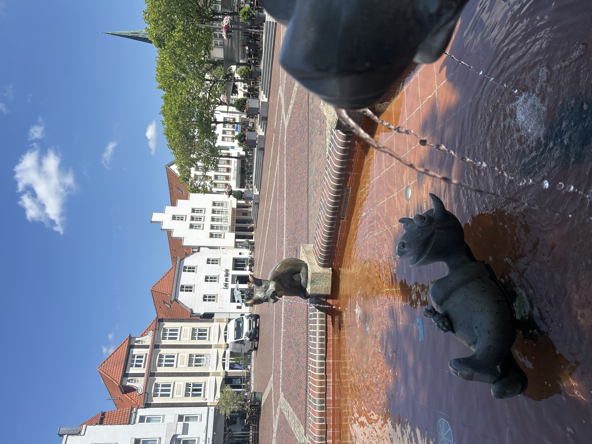 Sunny afternoon around Lingen's bronze fountain square