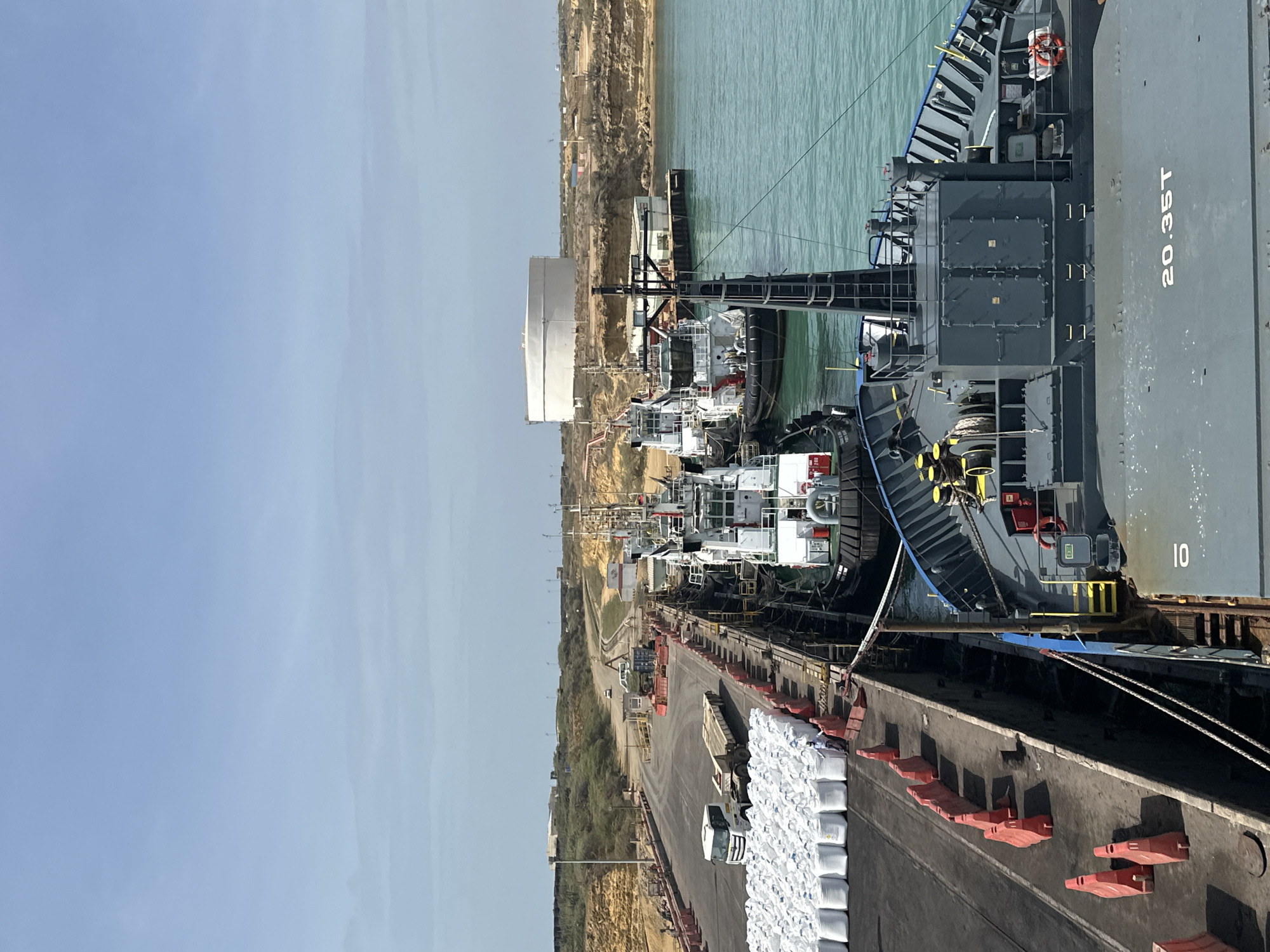 Cargo ship with bulk containers documented at Uribia port