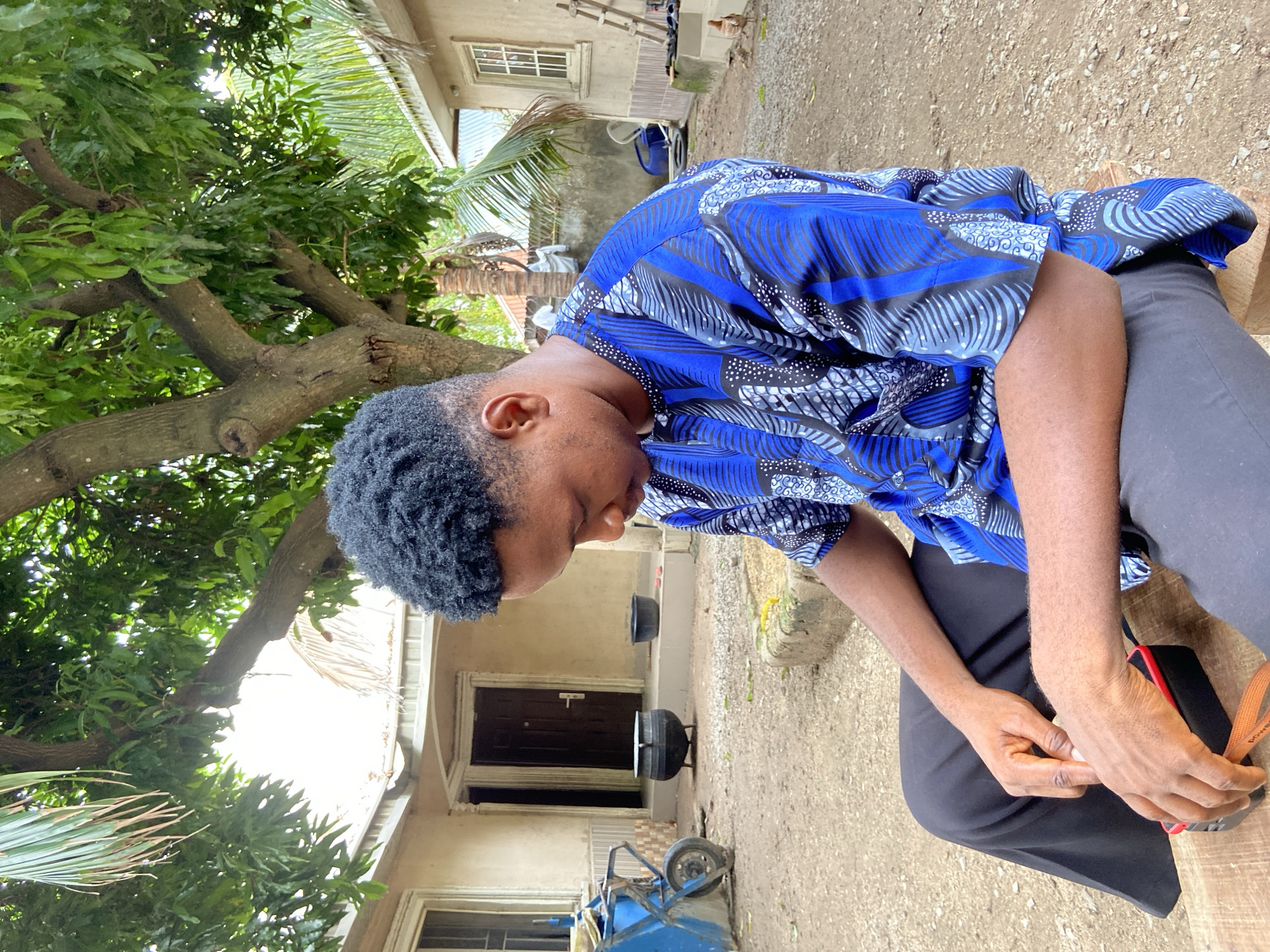 Young man poses for photos in Mararaba neighborhood
