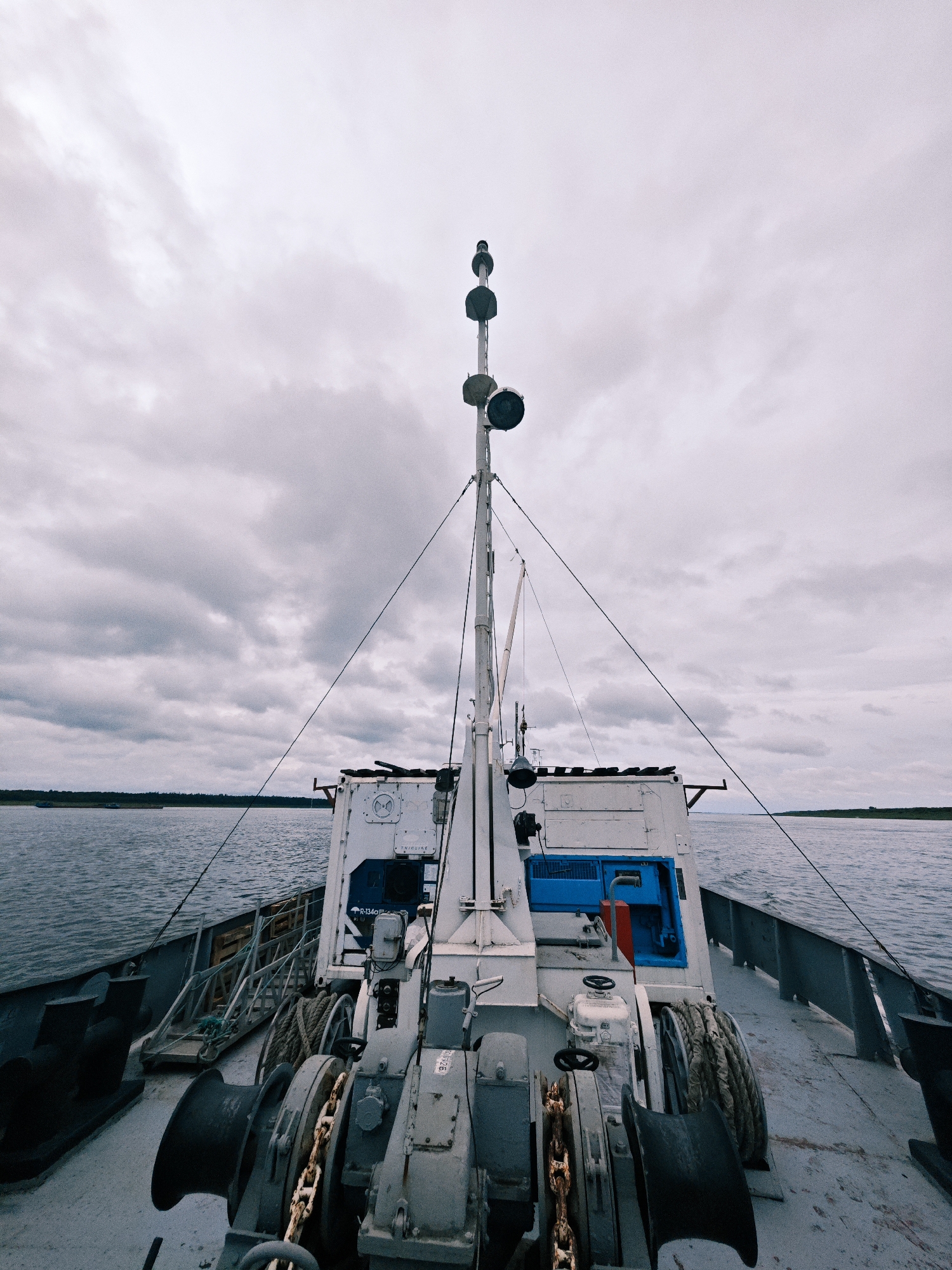 On deck as a ship pushes through grey Siberian waters