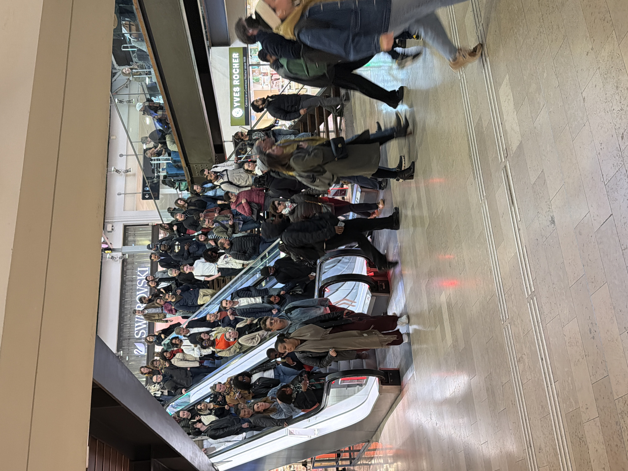 Morning crowd fills Paris shopping mall escalator