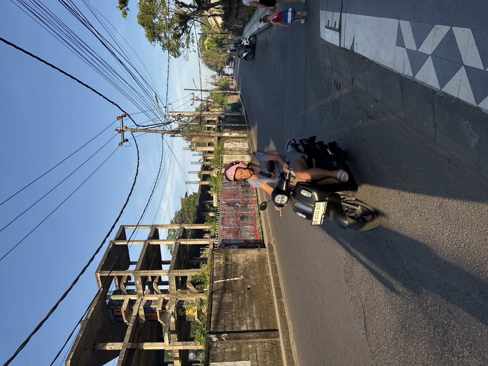 Sunny street life captured across Kuta, Indonesia resort district