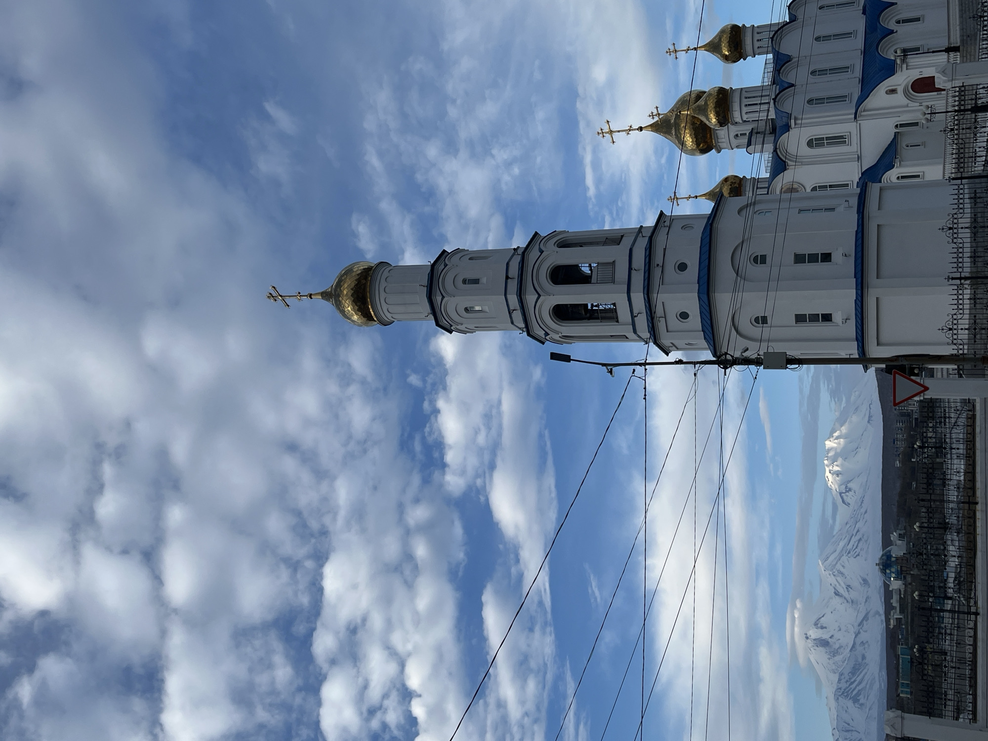 Orthodox cathedral documented in Petropavlovsk-Kamchatsky amid mountain backdrop