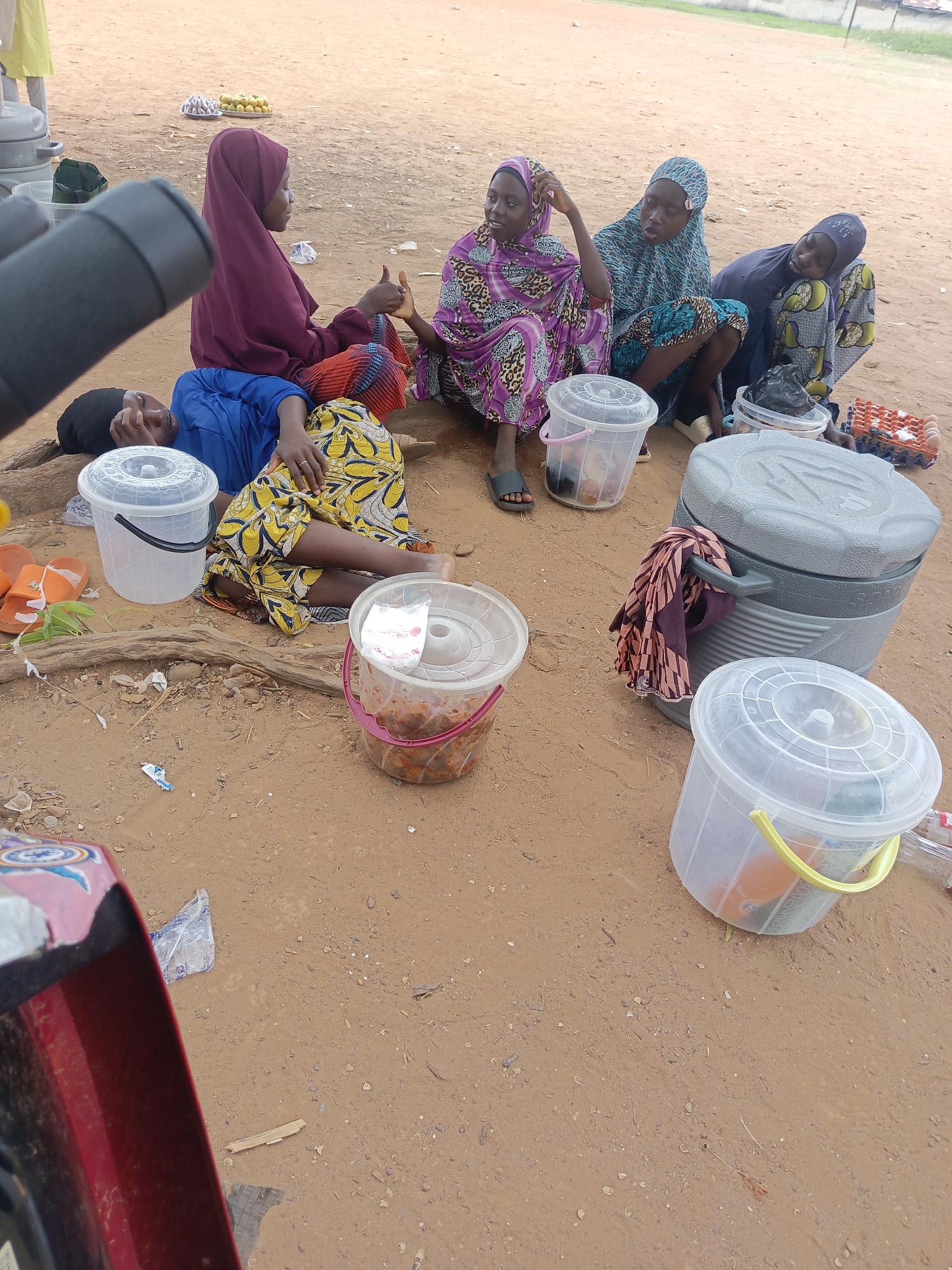Women gather in outdoor area in Akwanga, Nigeria