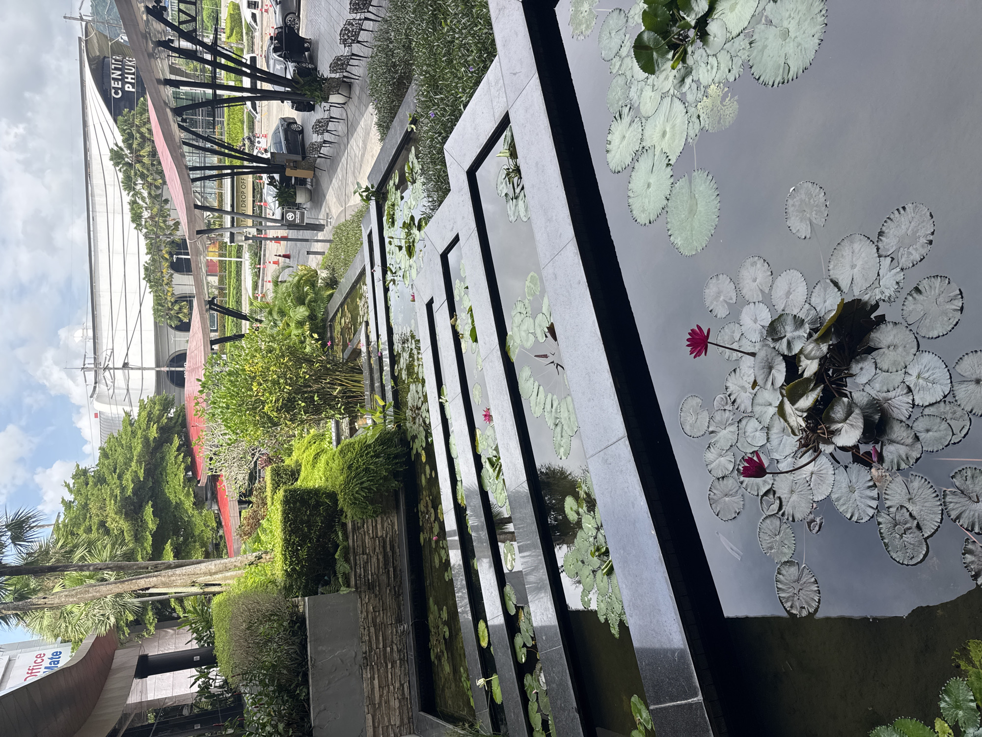 Afternoon at a Thai lifestyle mall with koi ponds and food stops