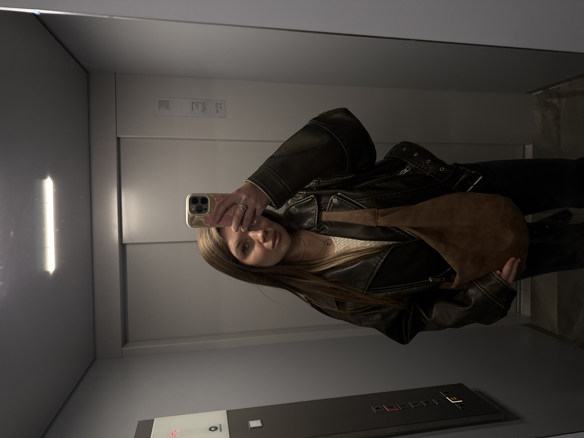Woman takes selfie in elevator in Belgrade suburb