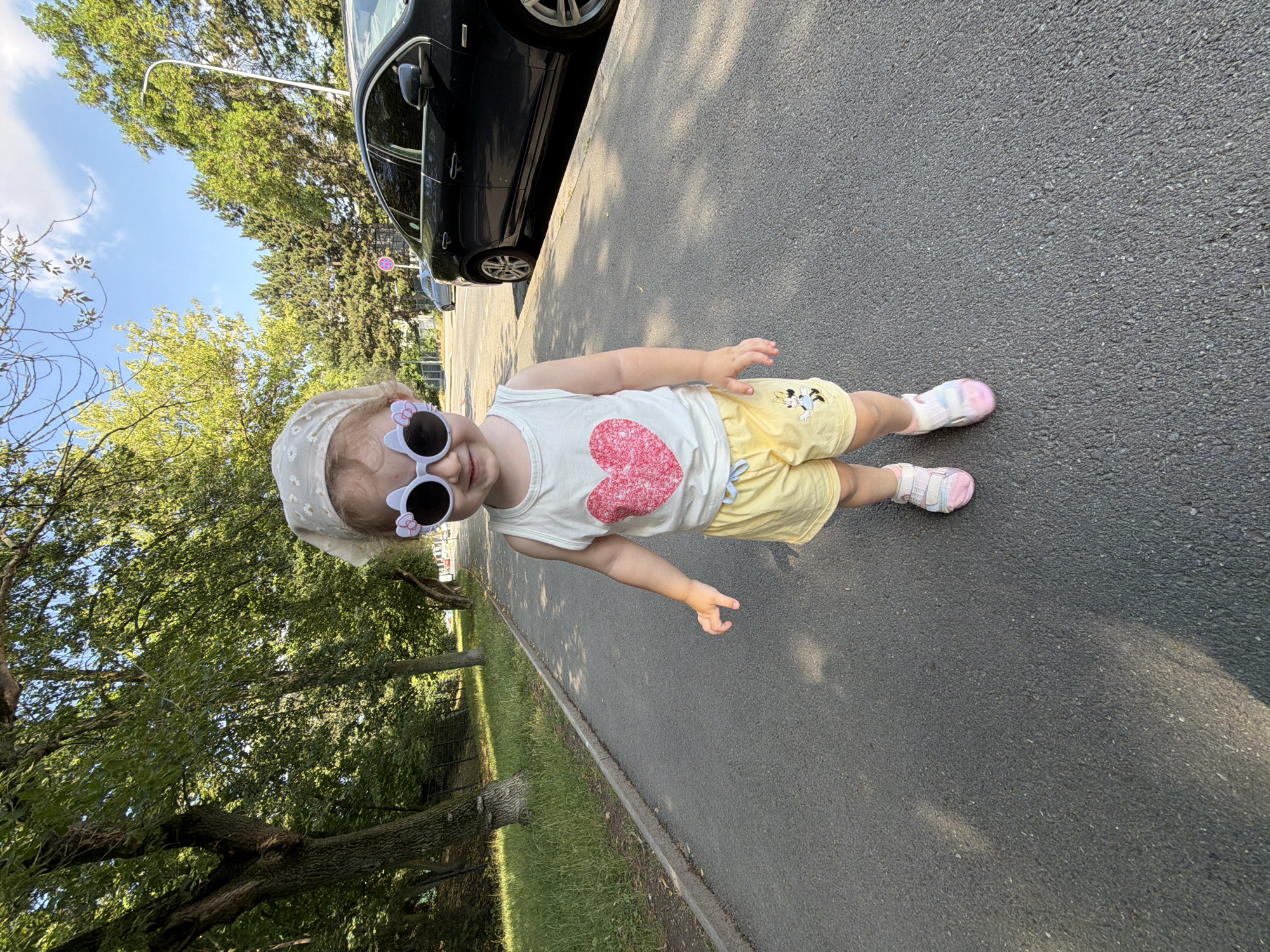 Morning playtime on a Prague path with toy truck and stroller