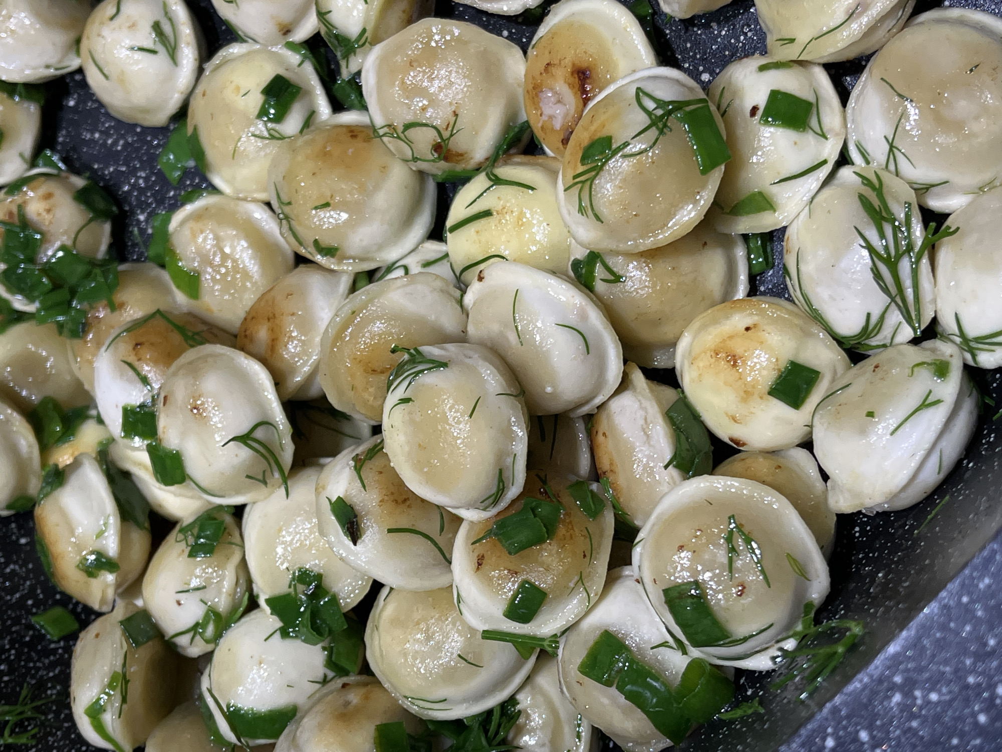 Lunch at home: pelmeni and a baby in a high chair