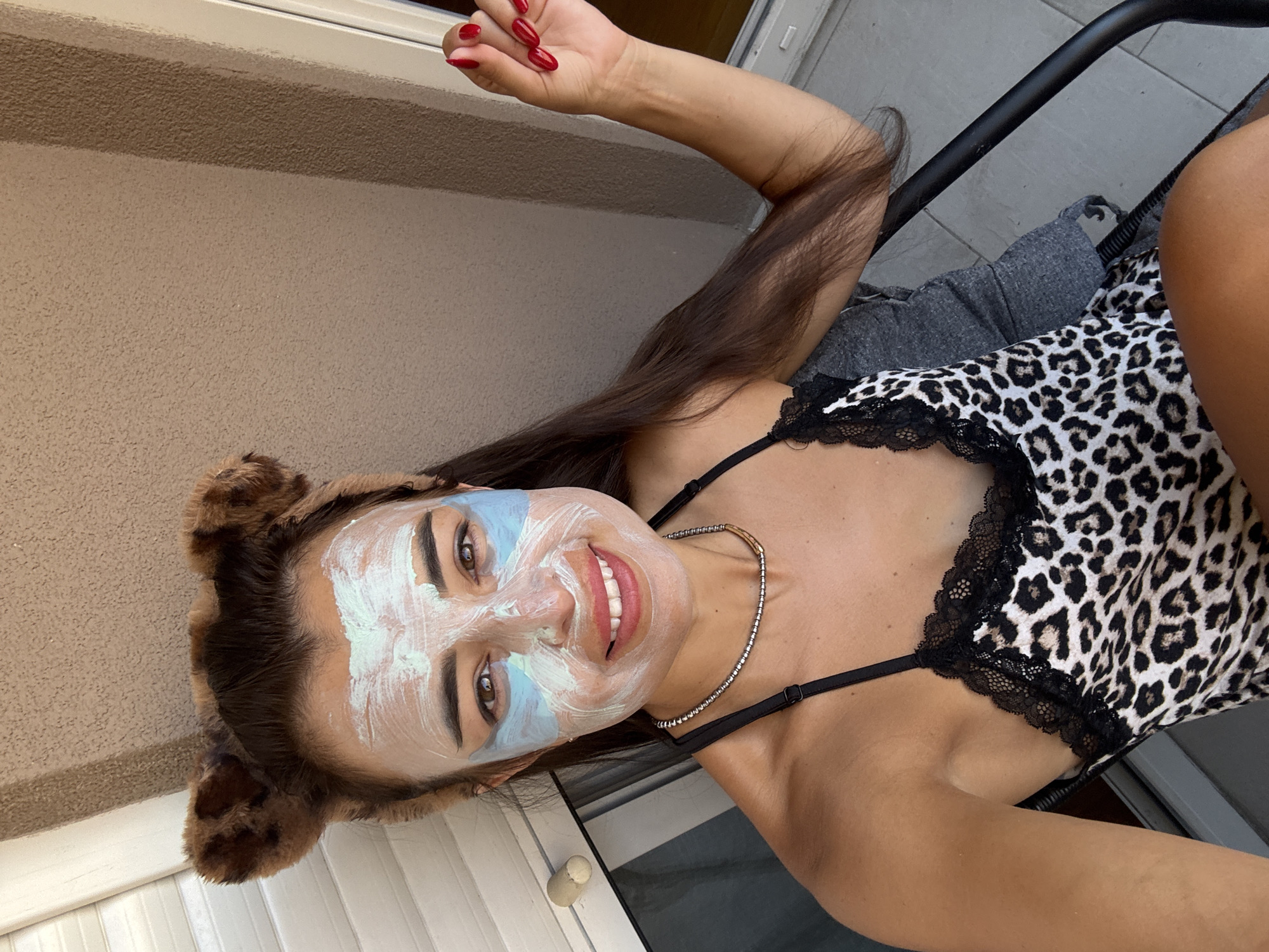 Outdoor face mask routine with a citrus drink in hand