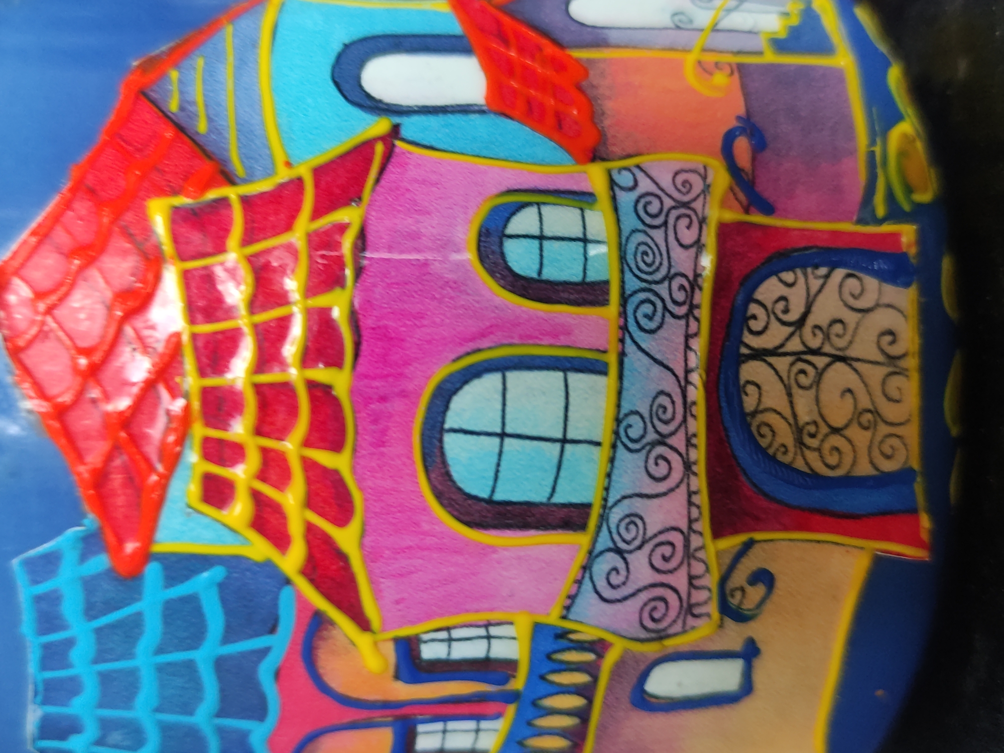 Artistic subjects documented: whimsical building drawing and rock figurine