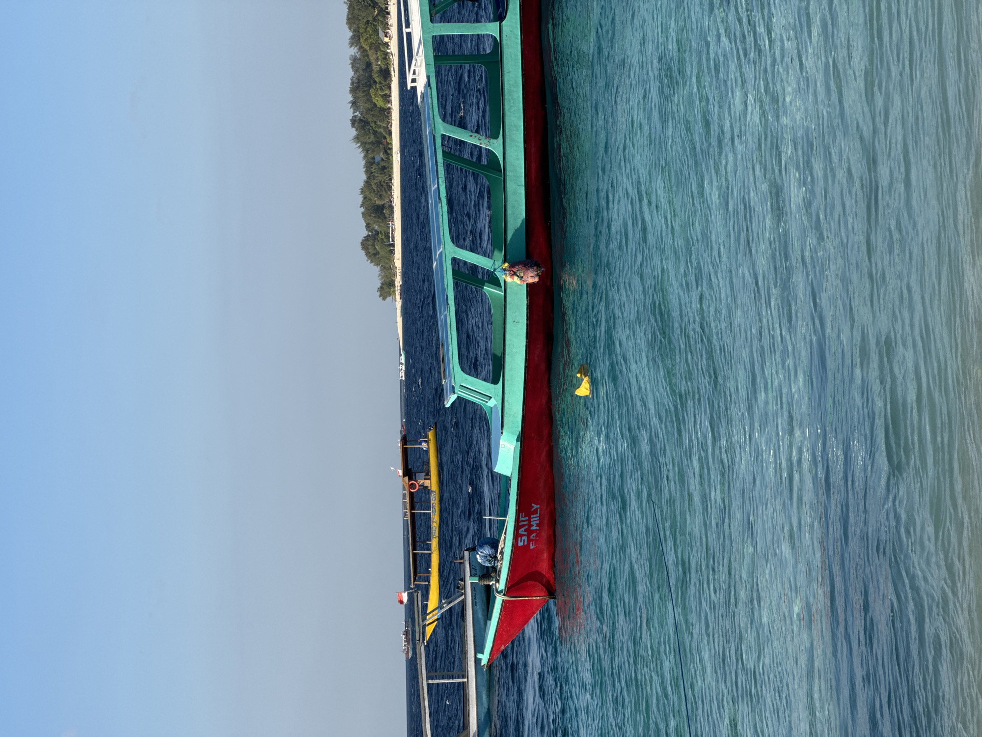 Boats, beach soccer, and turquoise water at the Gili Islands