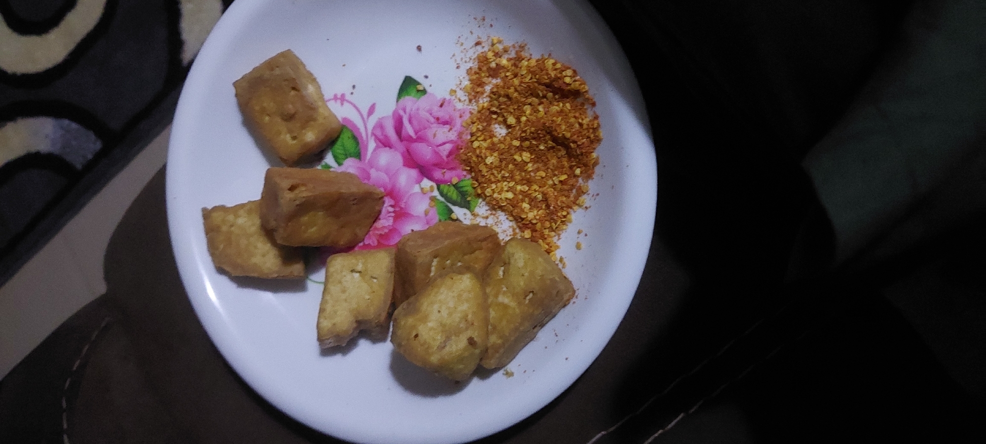 Fried tofu meal served at home with a side of ambiance