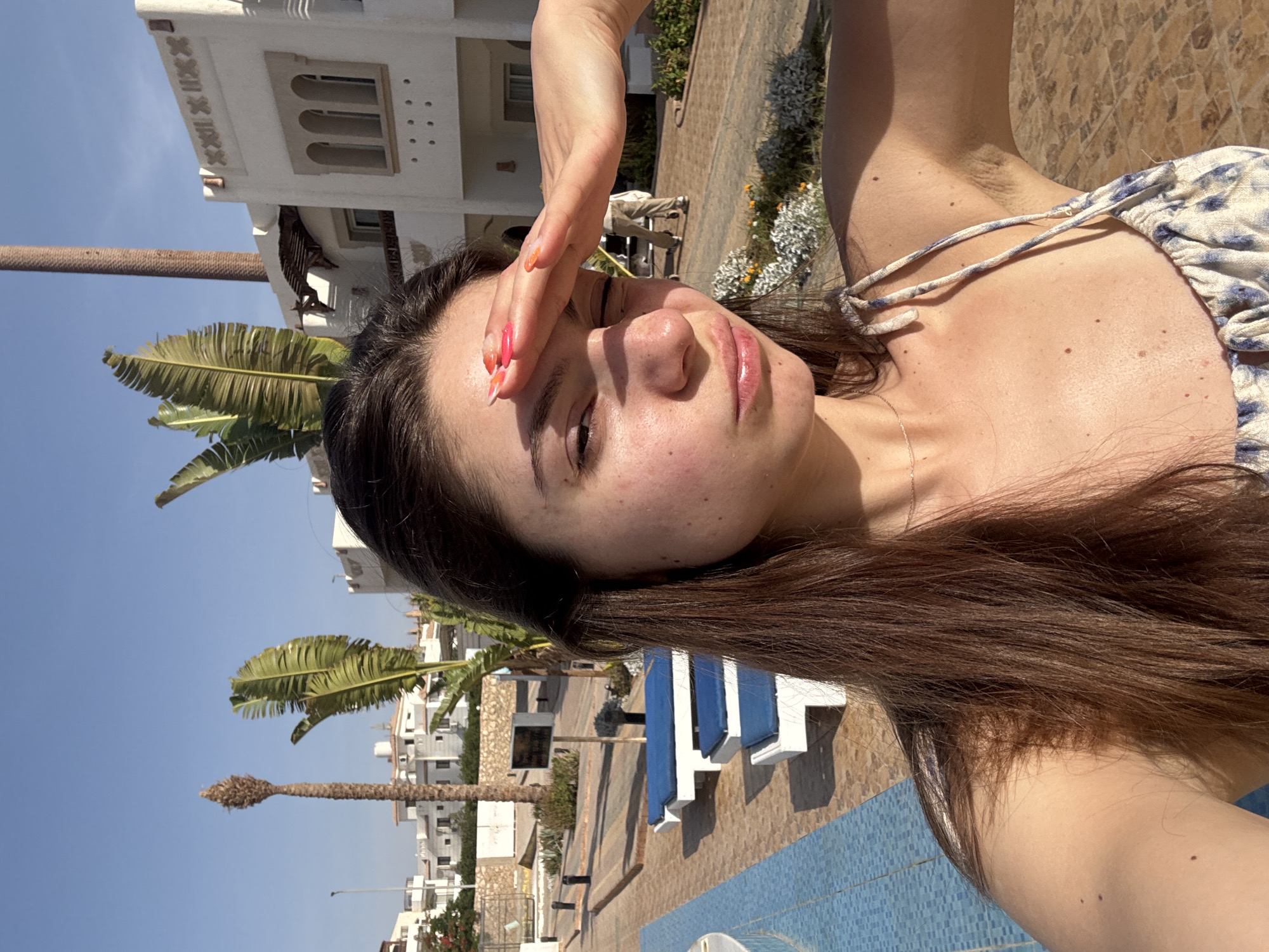 Woman documents tropical resort vacation in morning photo session