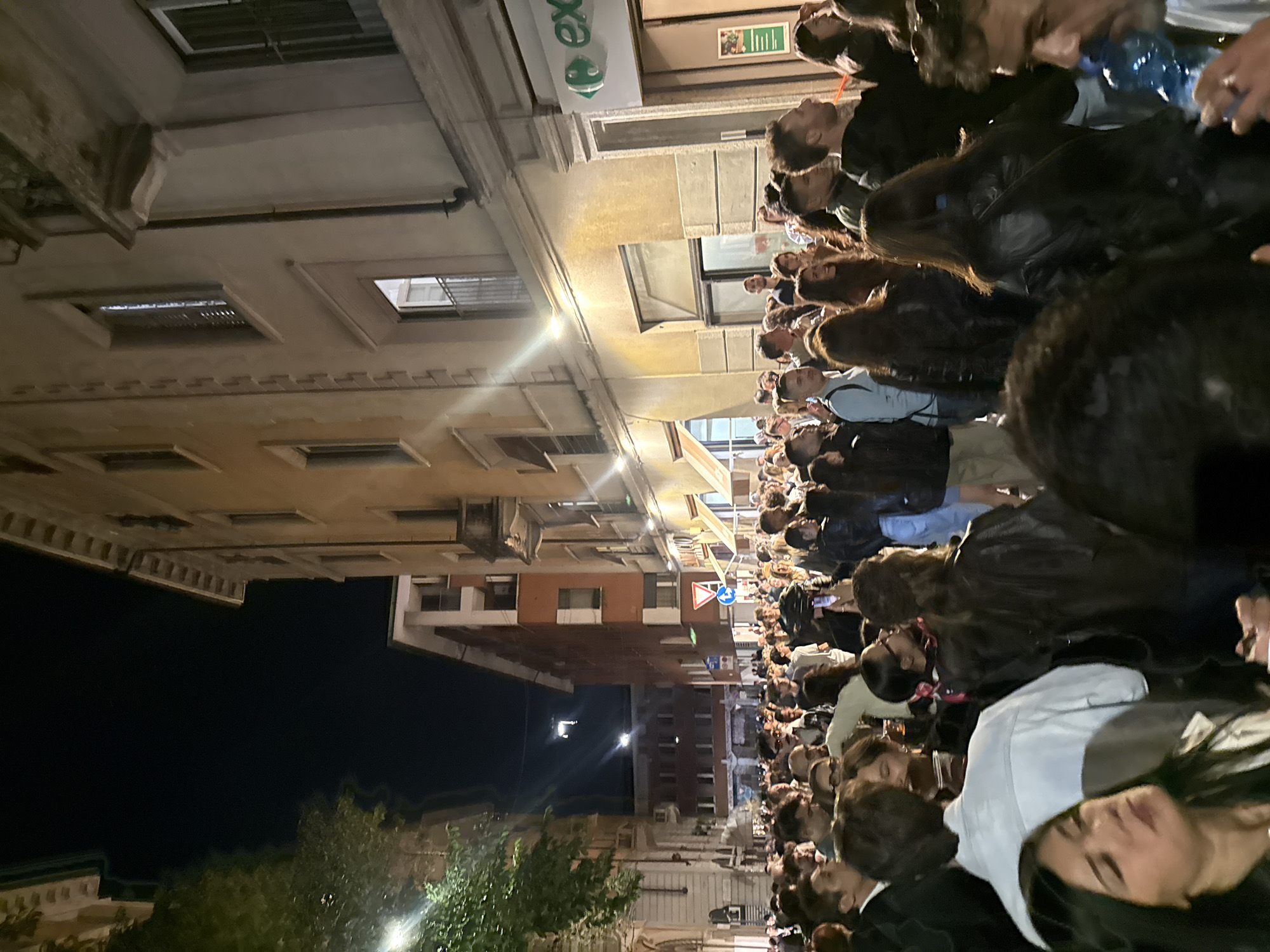 Large crowd gathers on Milan street Friday night