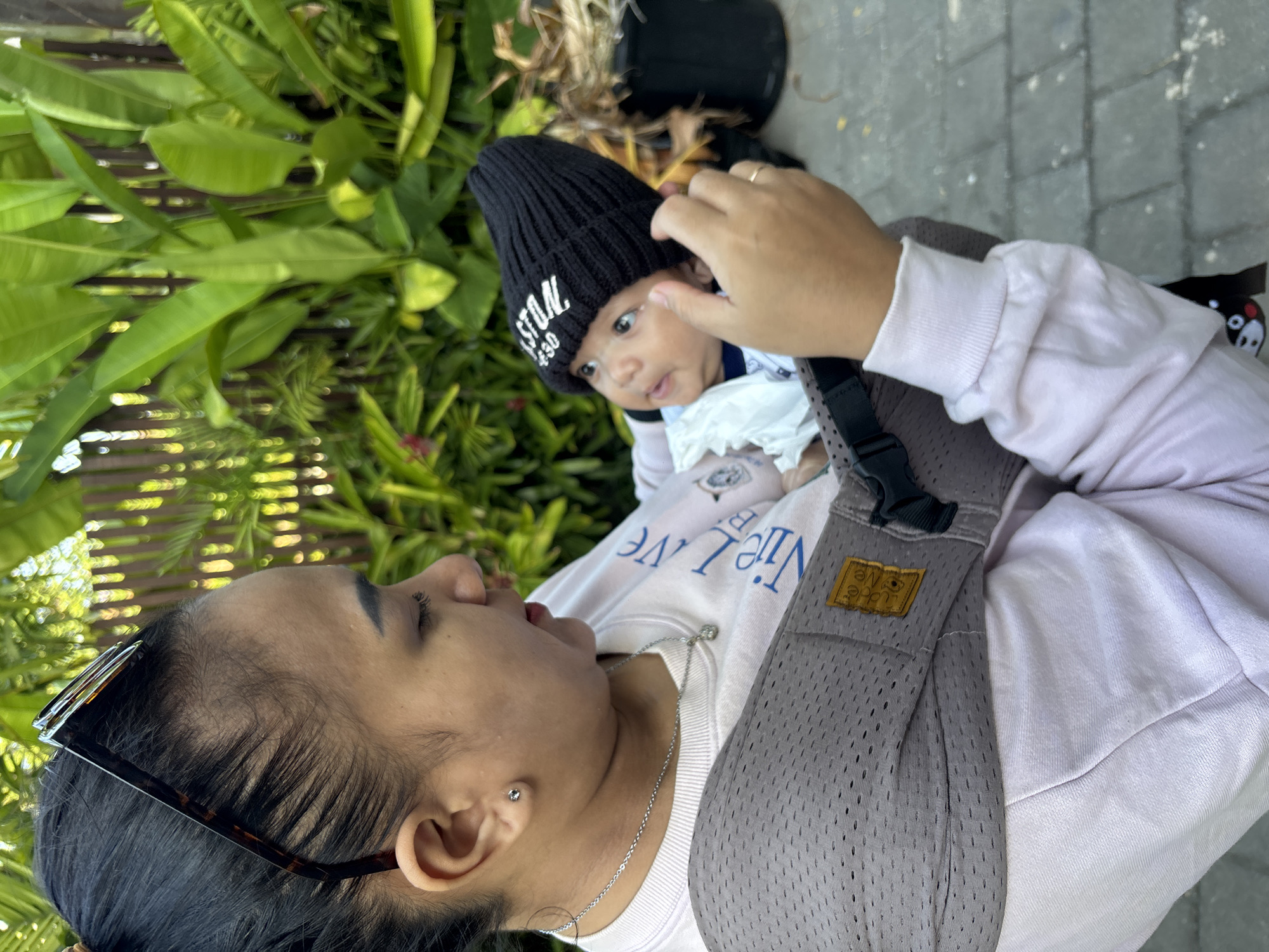 Baby outing in a lush Mengwi garden setting