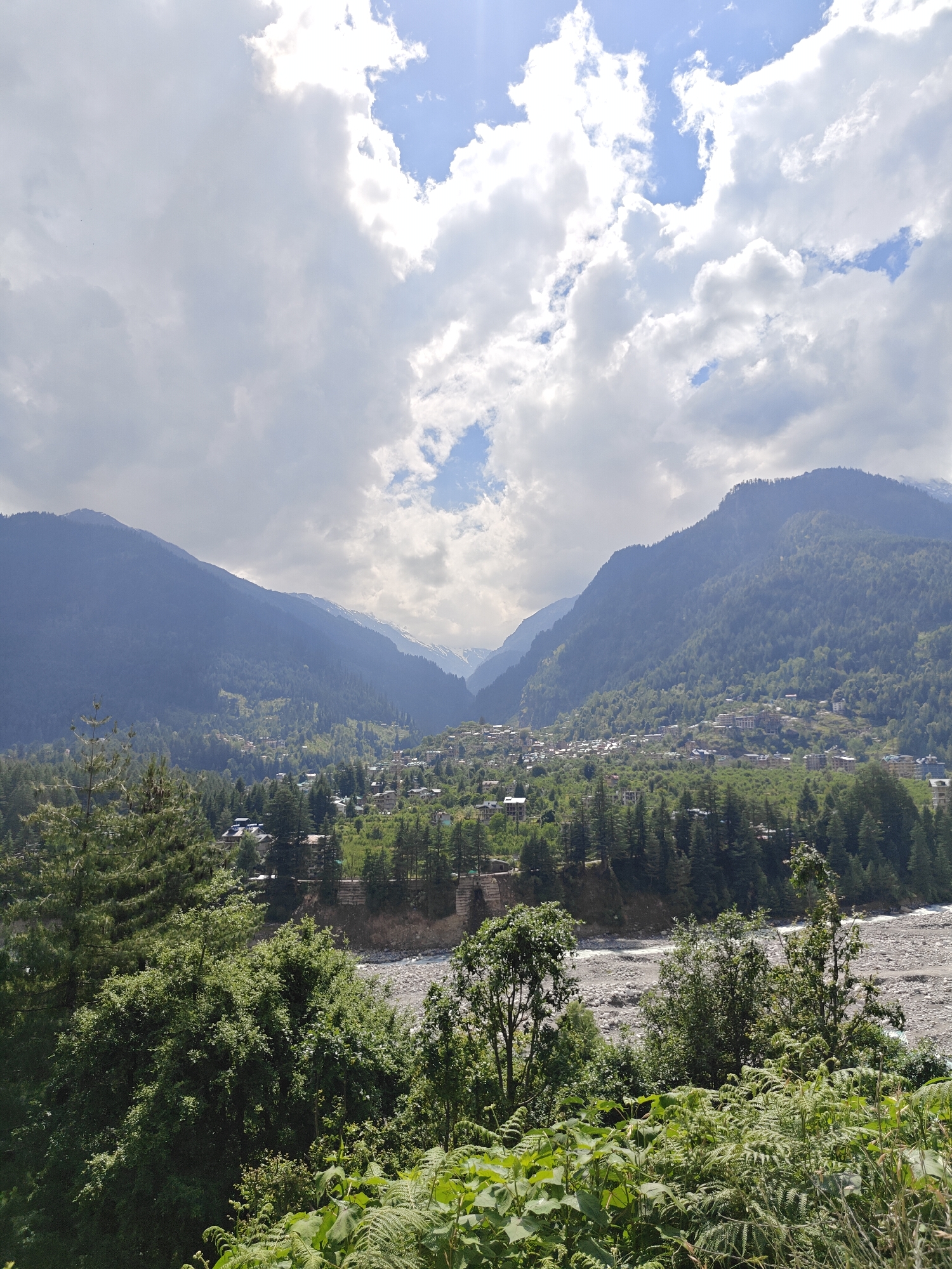Tourist captures panoramic valley views in Manali, India