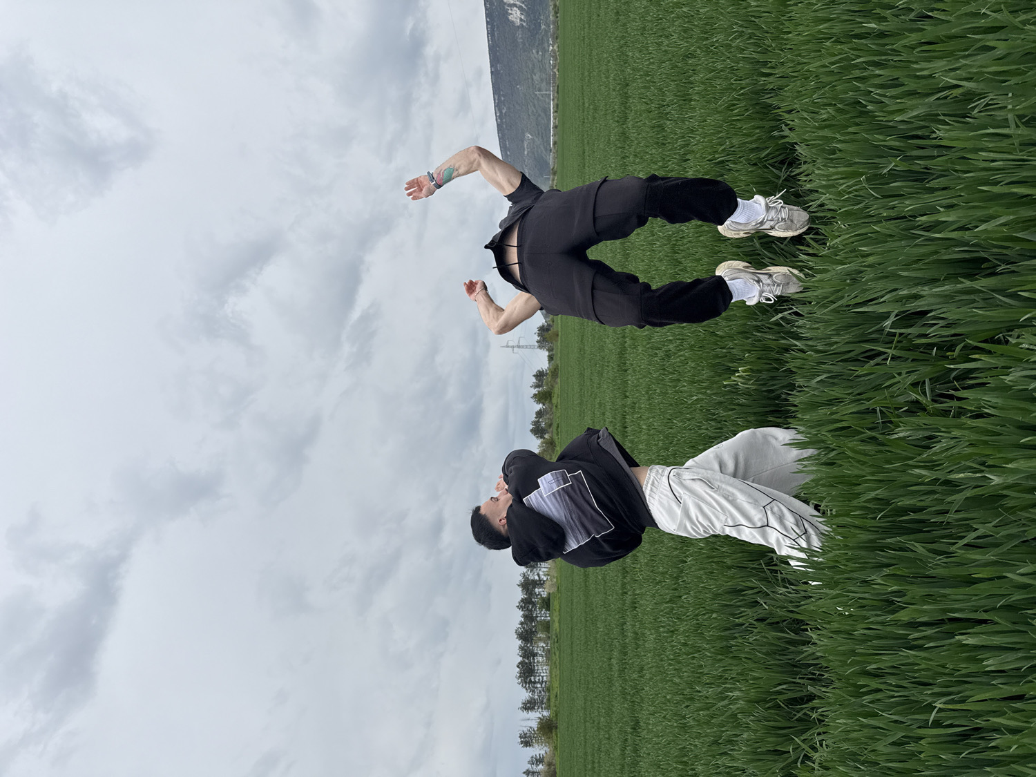 Two people pose in crop field in Shumen, Bulgaria