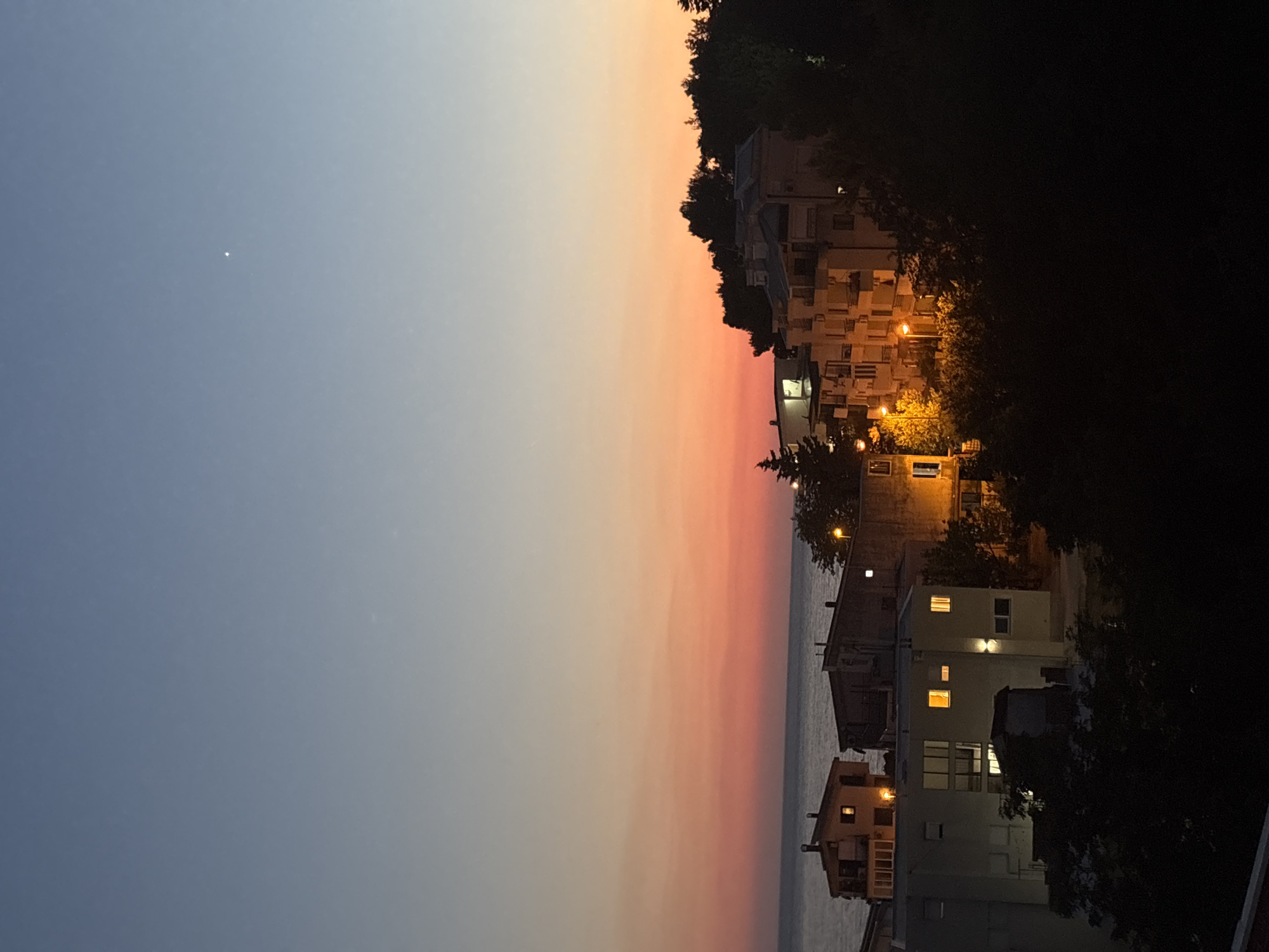 Dusk settles over Bar, Montenegro's coastline and rooftops