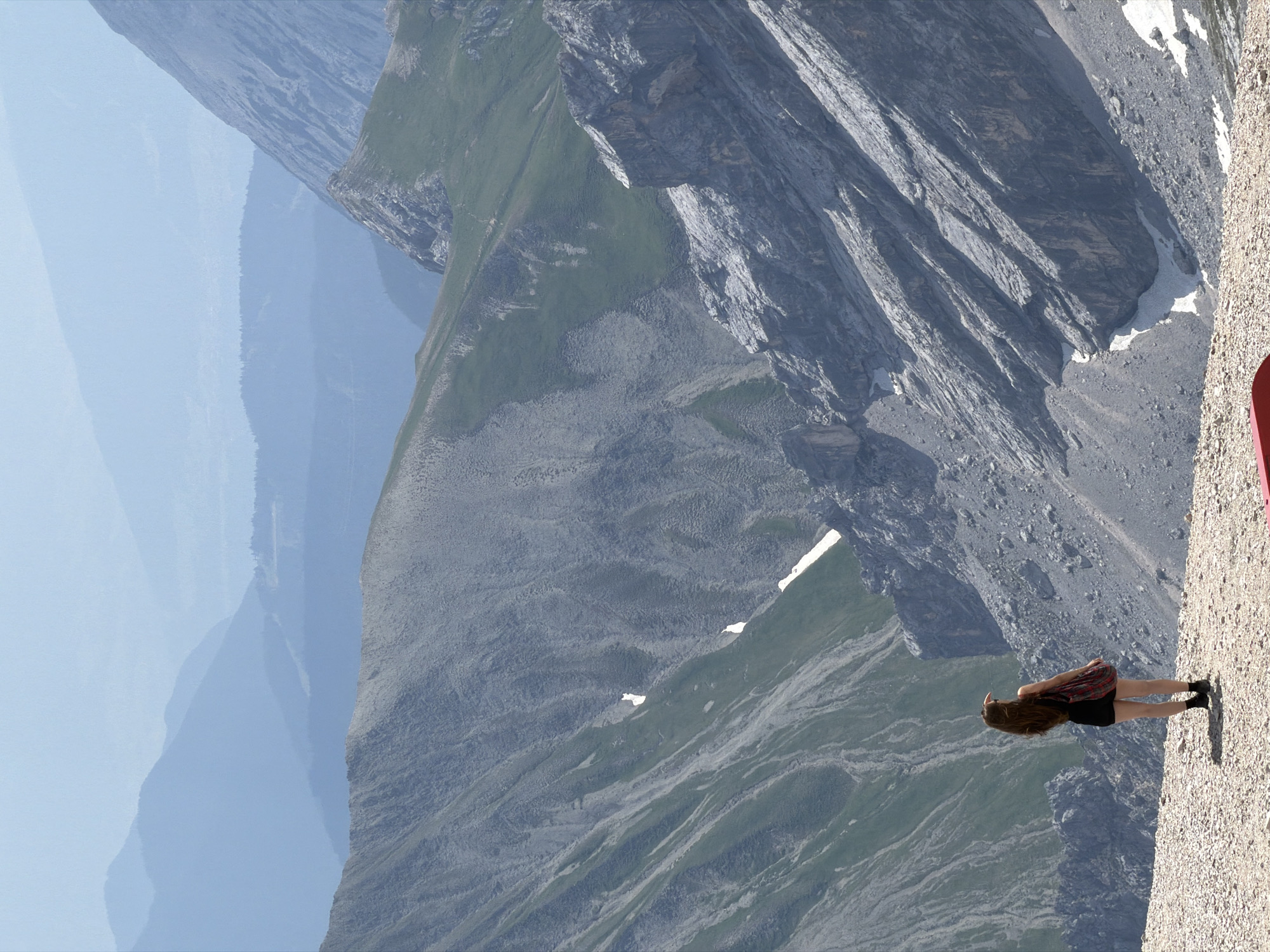 Overlooking a vast alpine panorama from a rocky Garmisch ledge