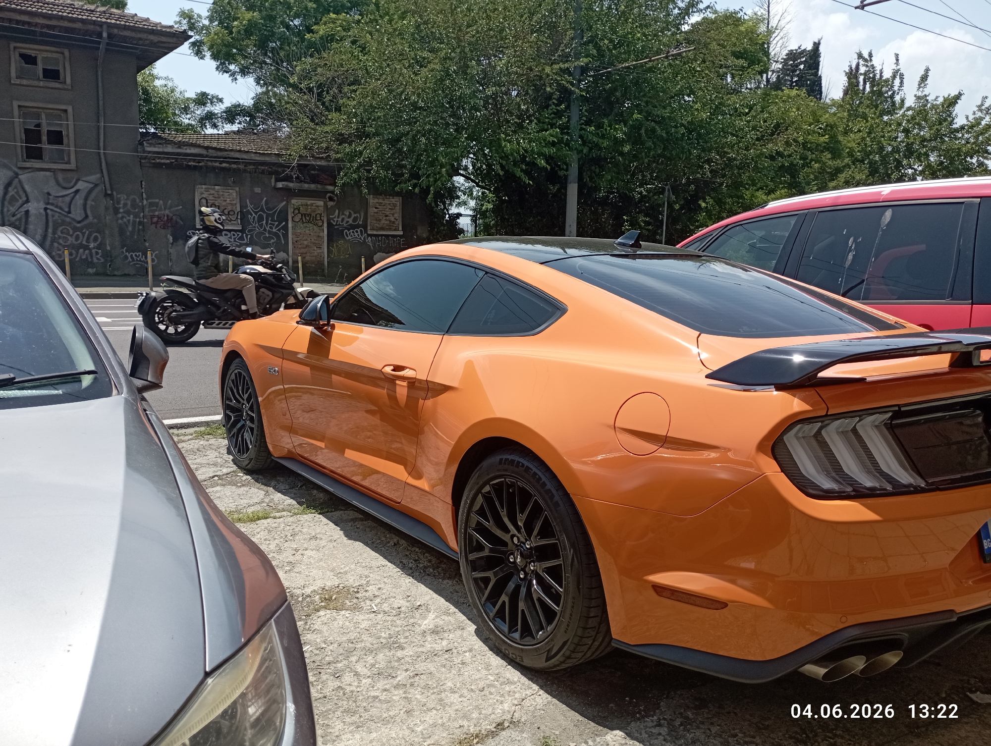 Orange Ford Mustang GT spotted parked in urban area