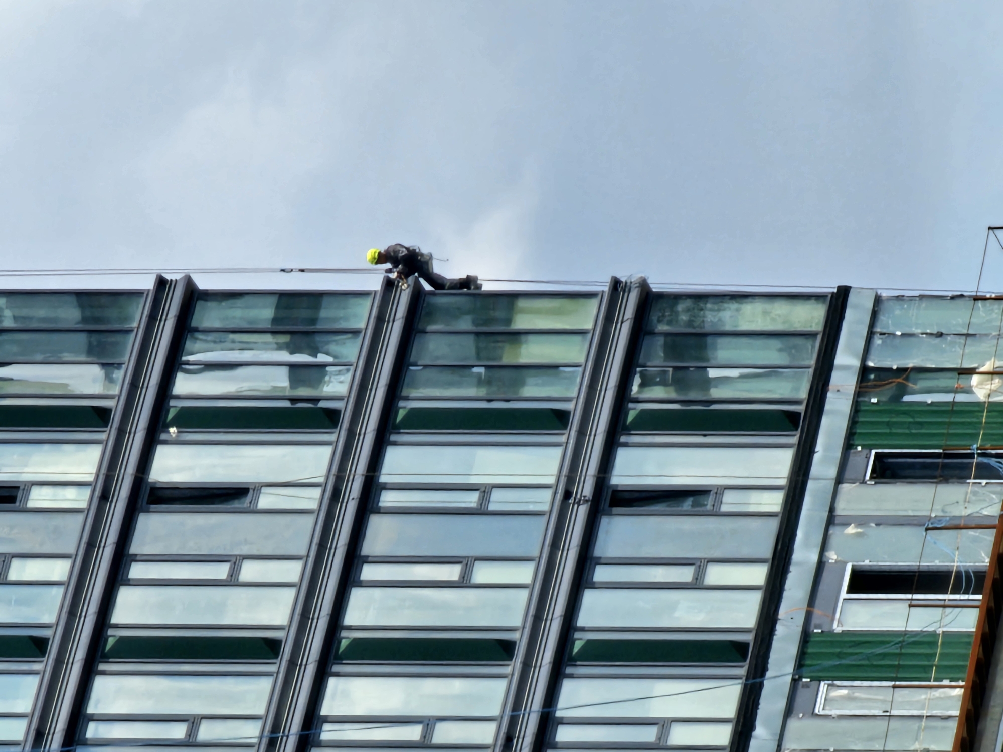 High-rise window cleaning on a Moscow glass tower