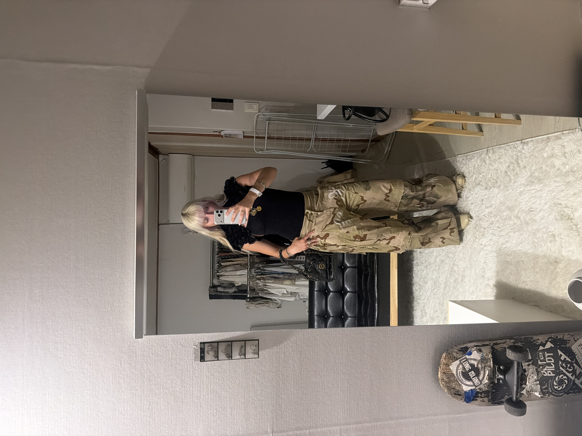 Woman Takes Mirror Selfie in Seoul Bedroom