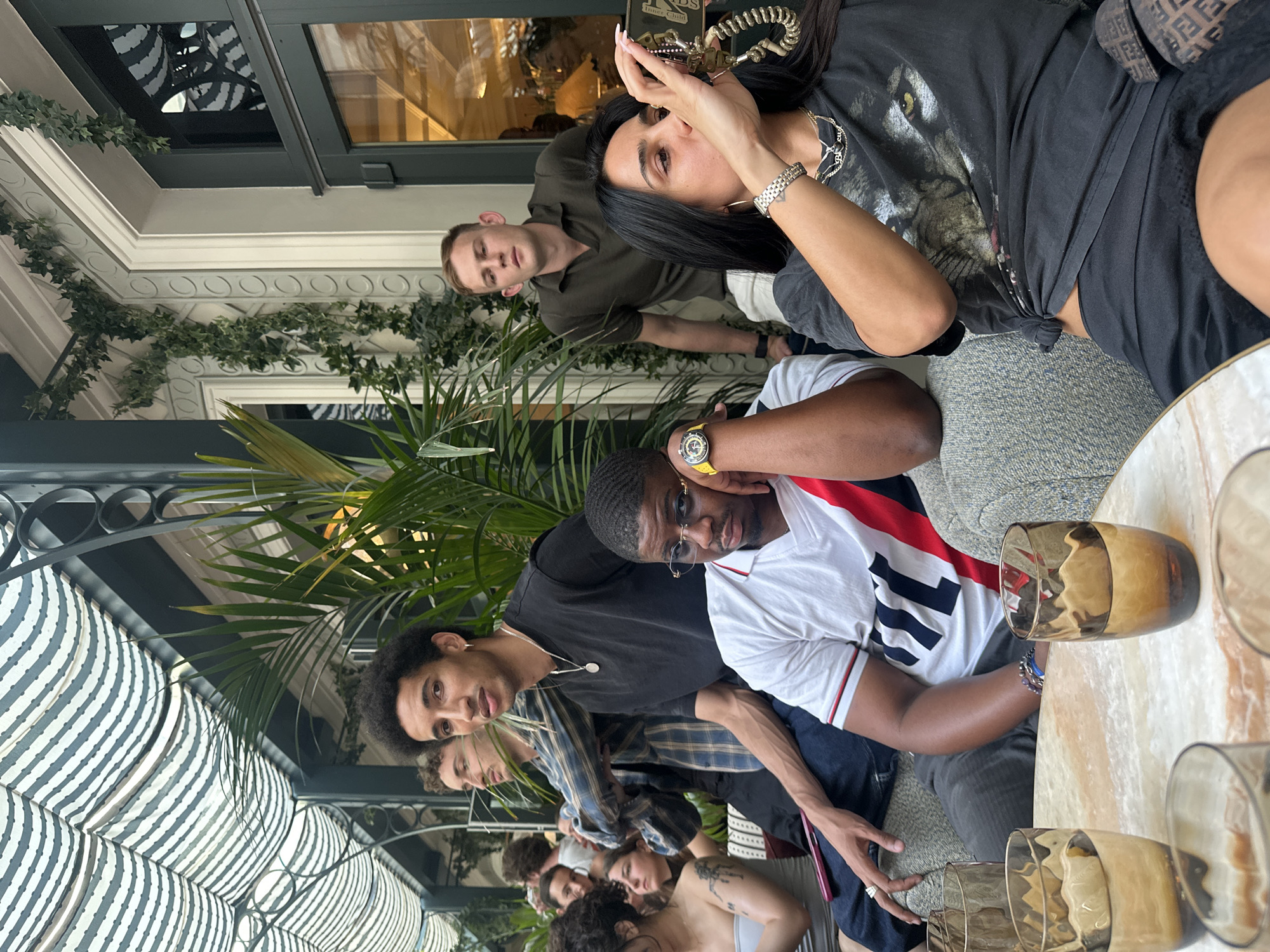 Friends gather at Paris café, PSG jerseys spotted