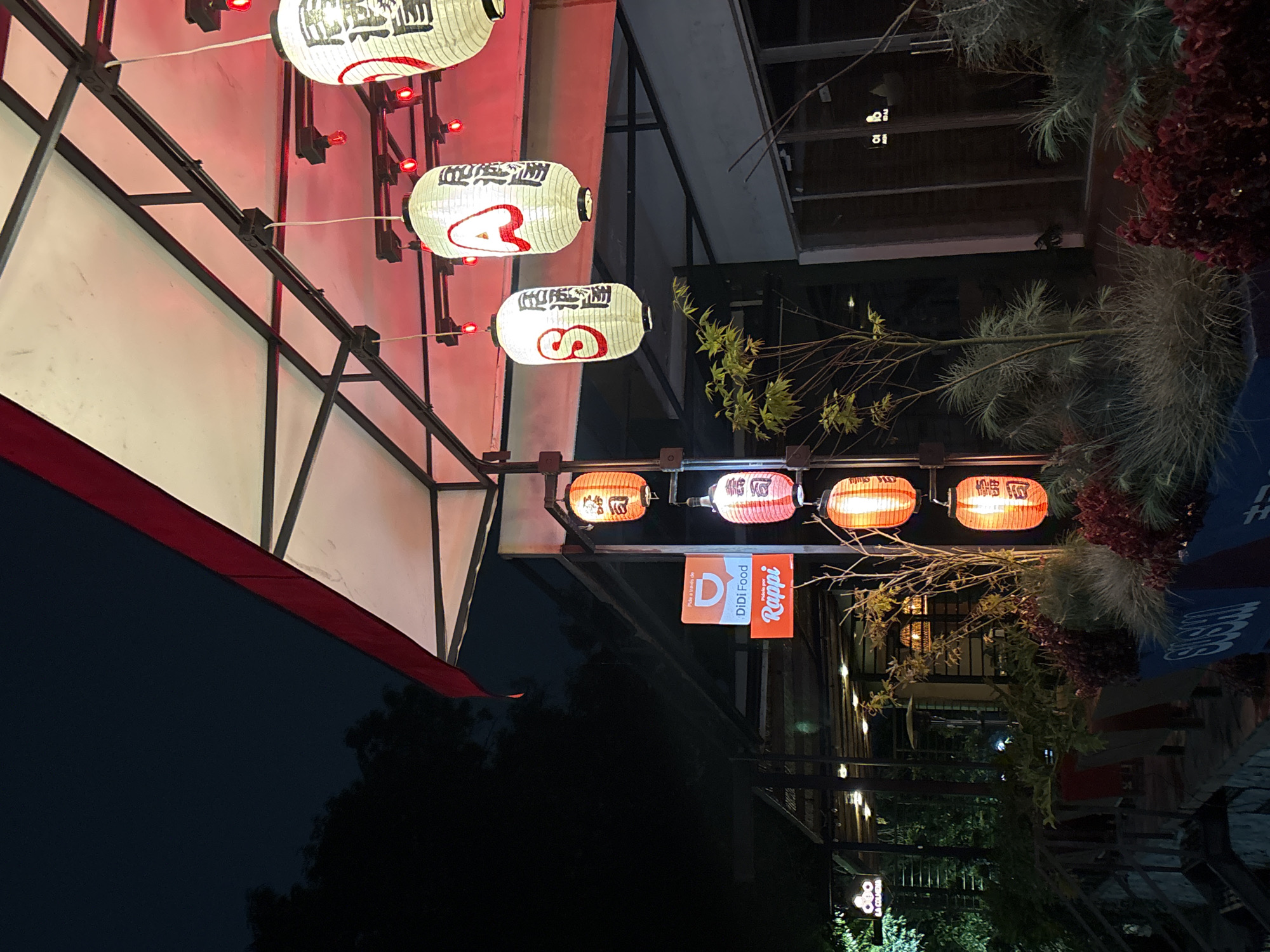 Japanese lantern restaurant illuminated at night in Cholula, Mexico