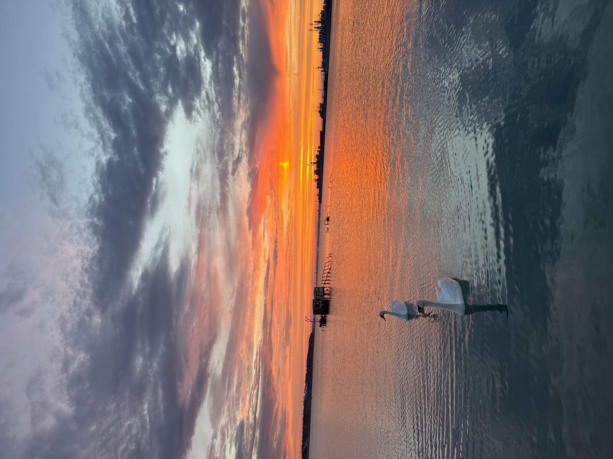 Burgas sunset over the Black Sea, plus old industrial machinery nearby