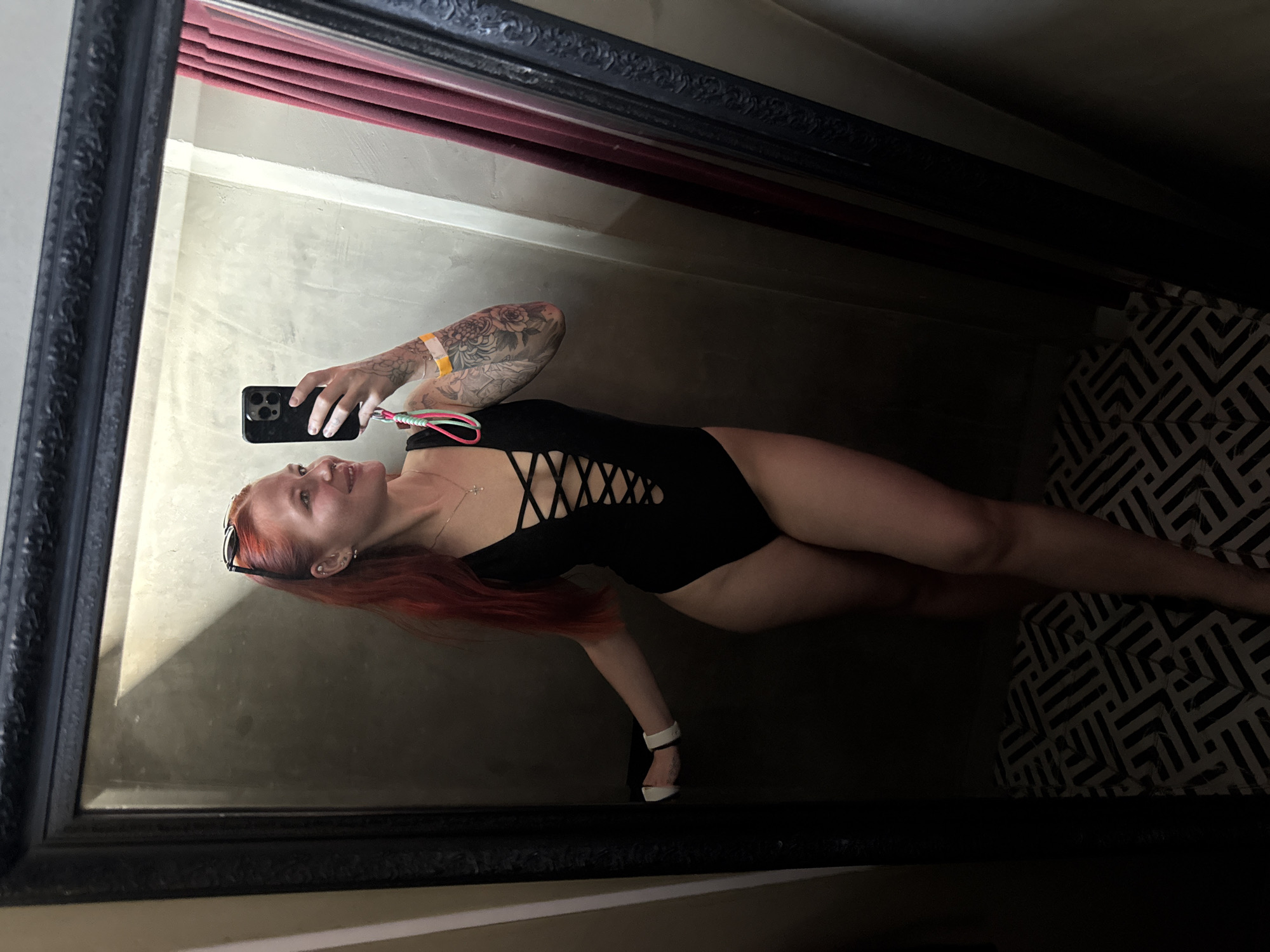 Woman in swimsuit poses before mirror in Rostov-on-Don