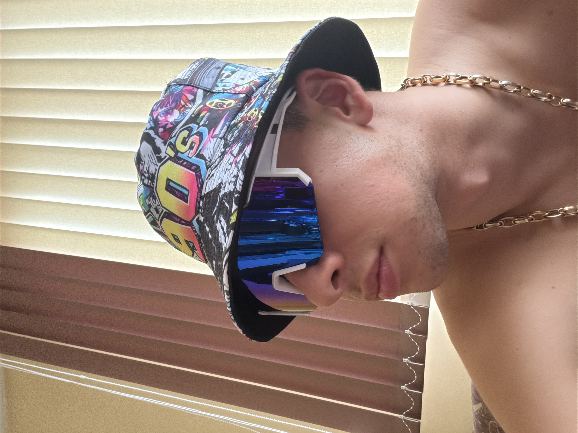 Person in bucket hat photographed indoors, Ford vehicle footage captured