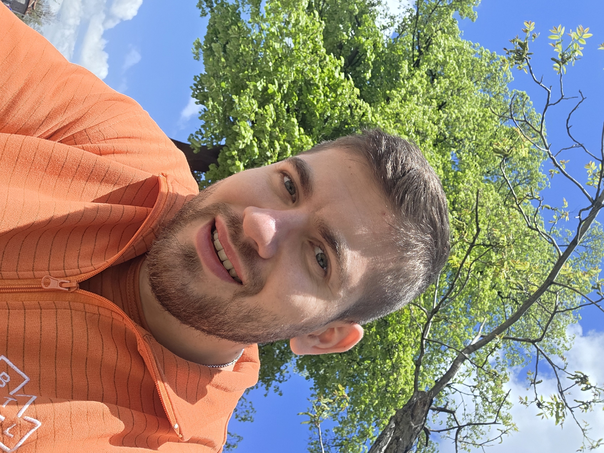 Man takes selfie near modern building in Plovdiv park