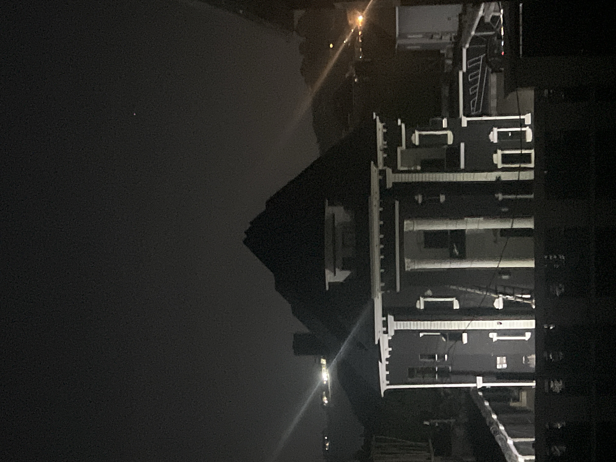 Illuminated multi-story building observed at night in Abuja