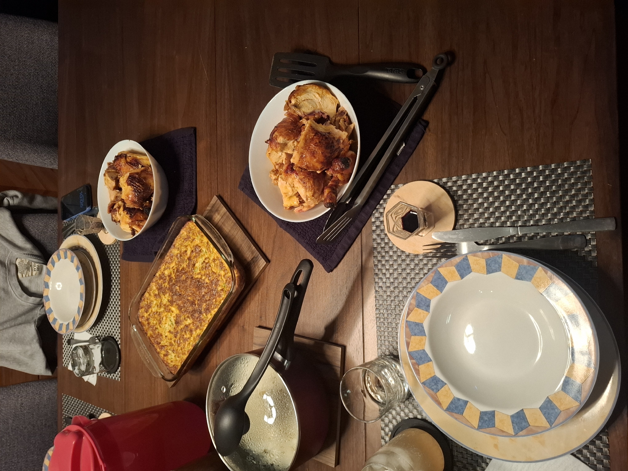Dinner table set with warm pot ready to serve