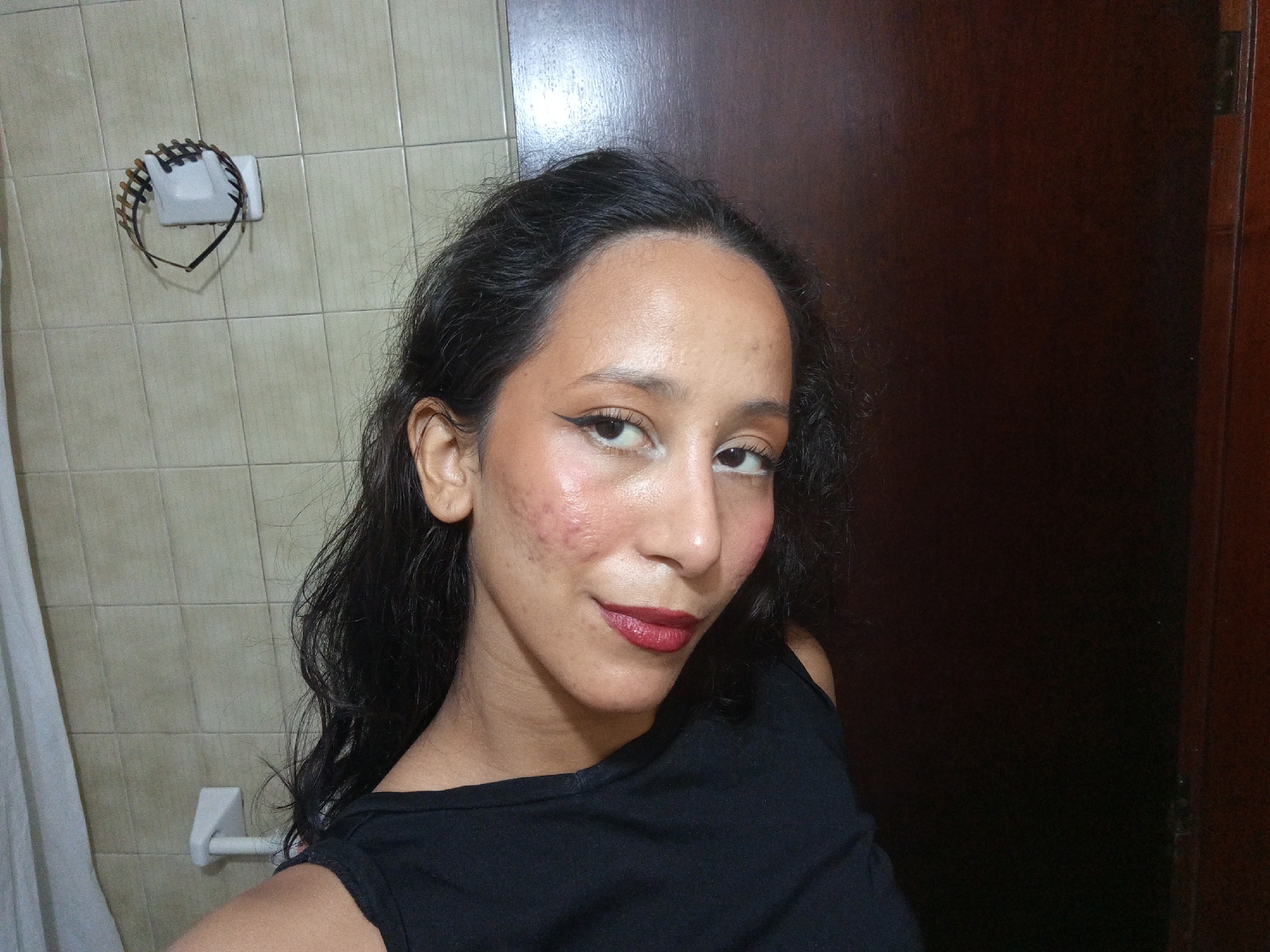 Woman takes bathroom selfie session in Porlamar, Venezuela