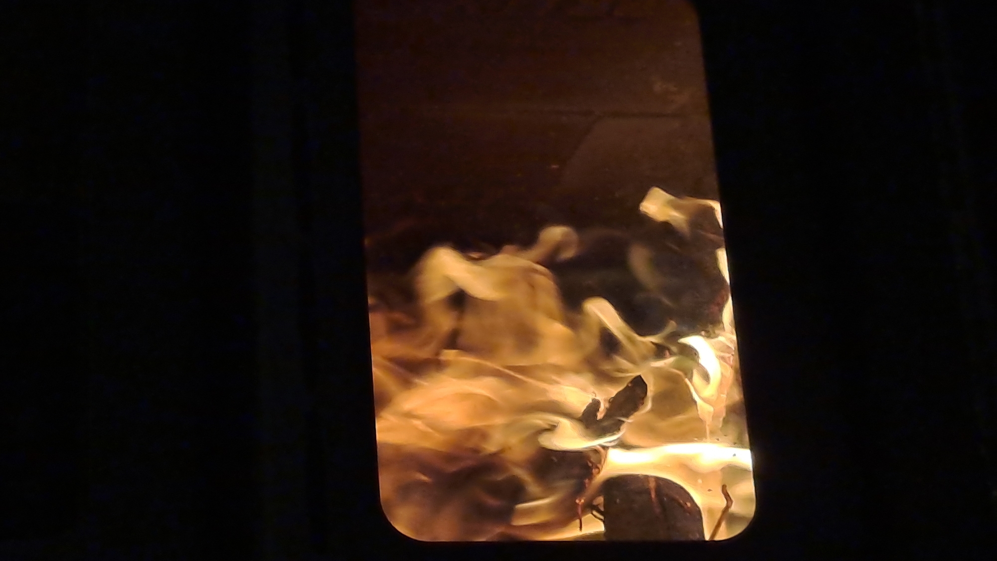 Morning wood fire burns in Bulgarian village stove