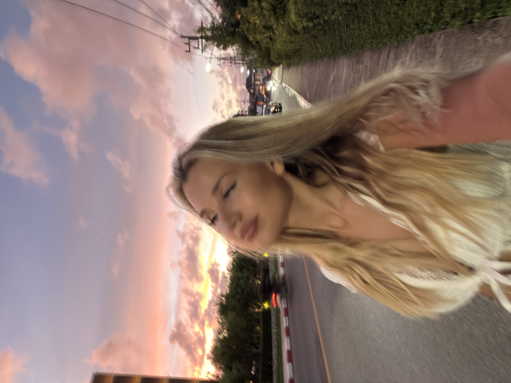 Selfie and street scene under a colorful Choeng Thale sky