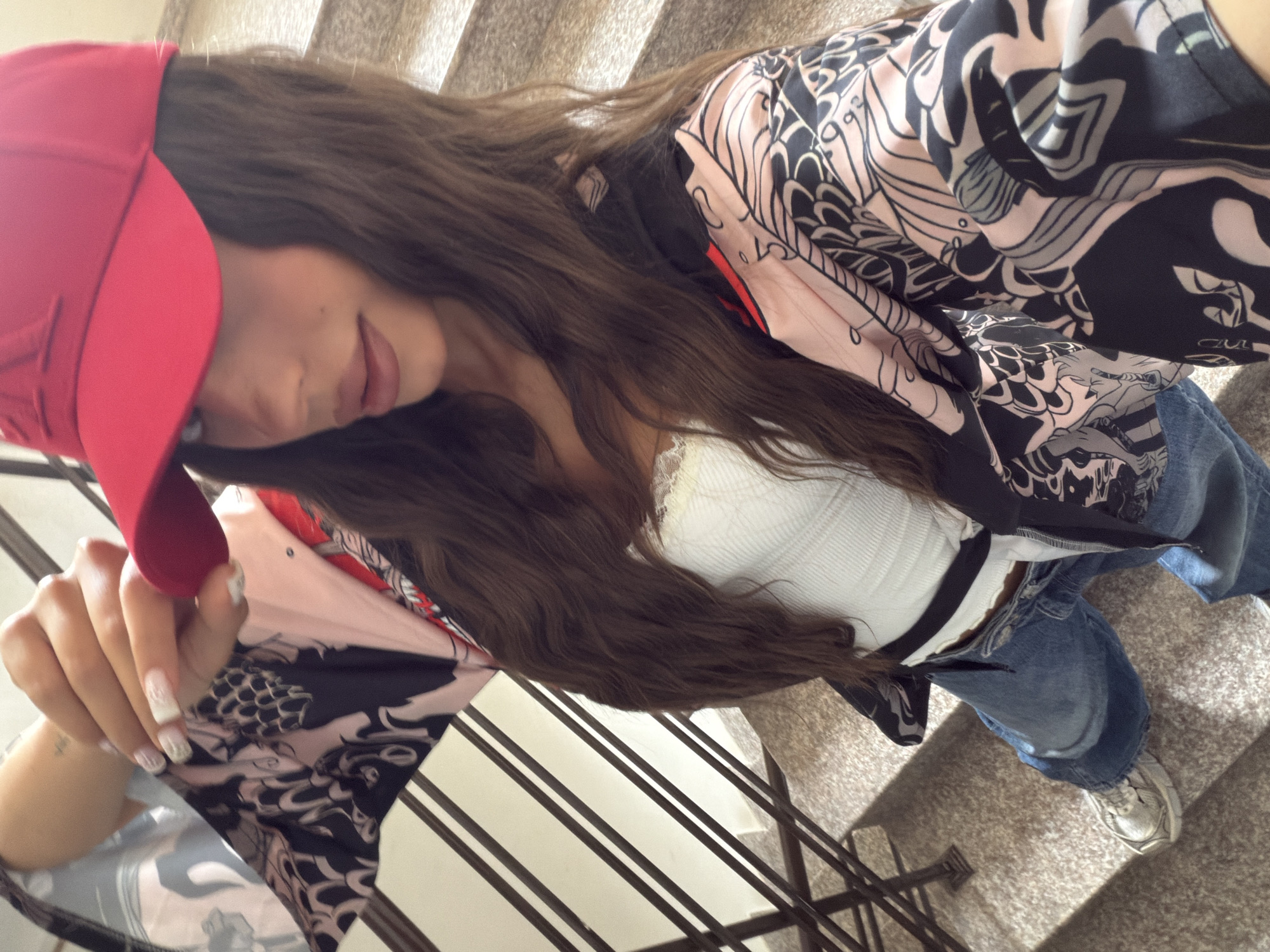 Woman in red cap spends morning with dachshund in Varna