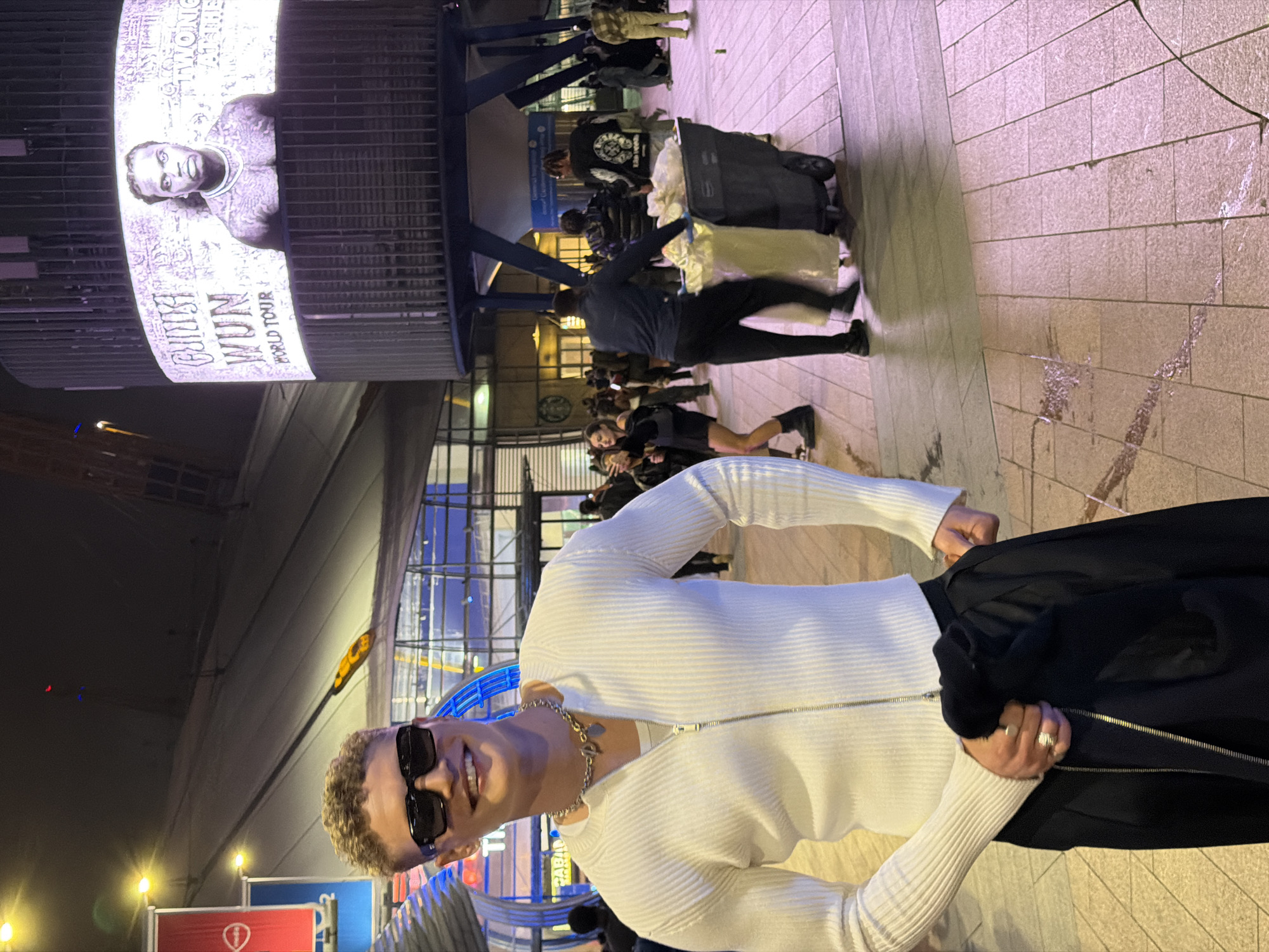 Man in white sweater observed in London public space