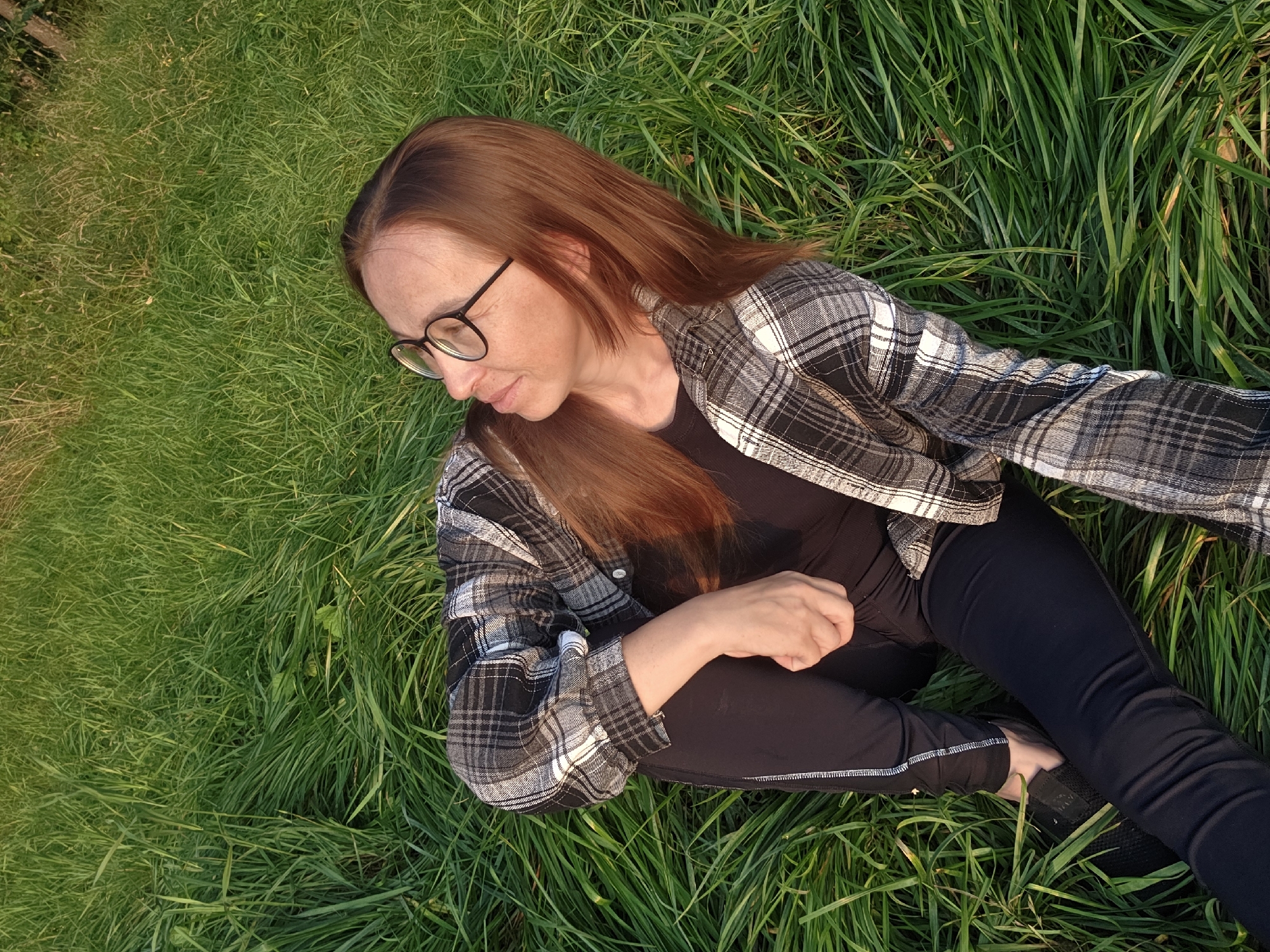 Sunset evening in the grass by Chaikovsky's waterfront