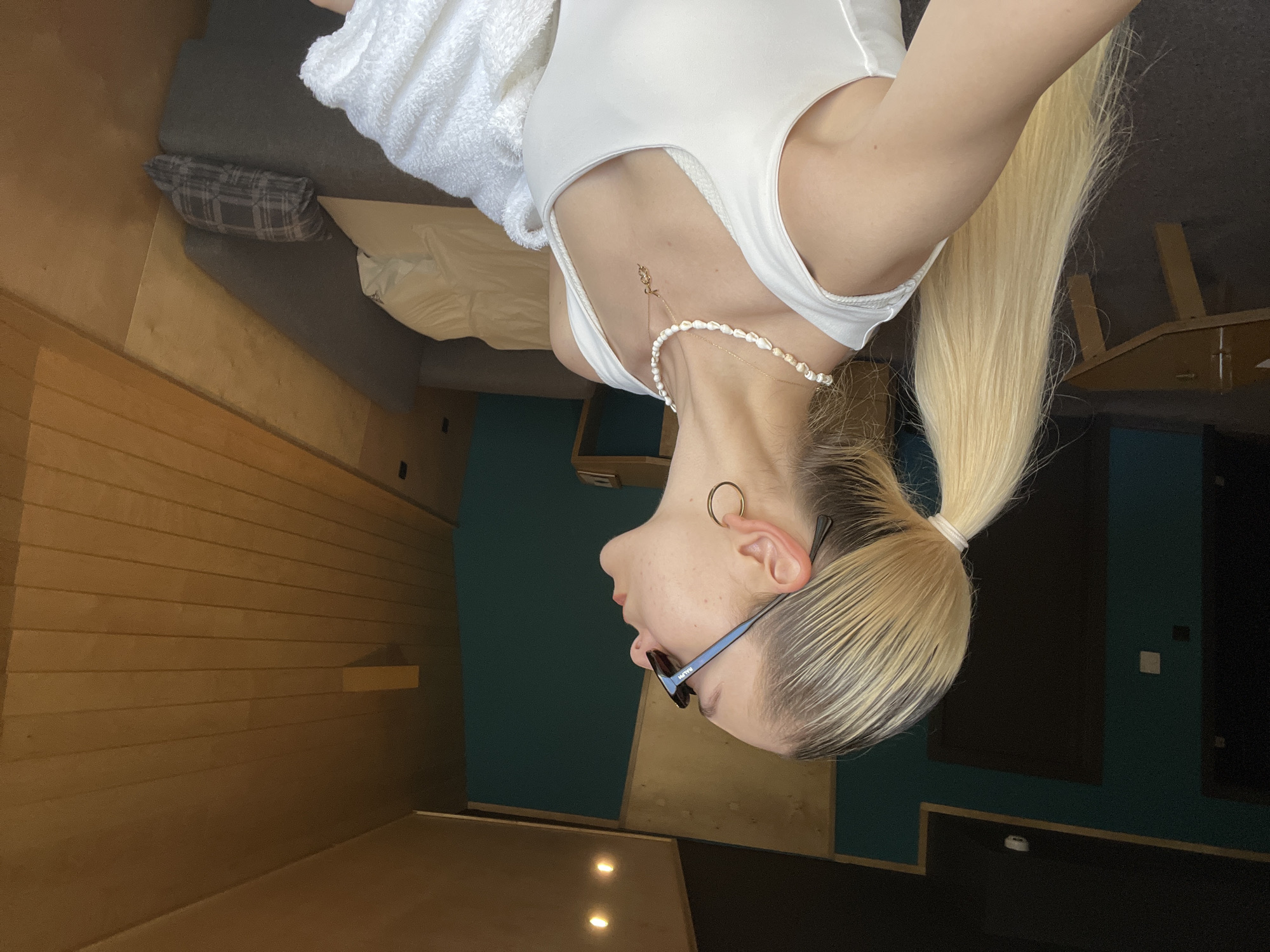 Woman takes multiple hotel room selfies during morning routine