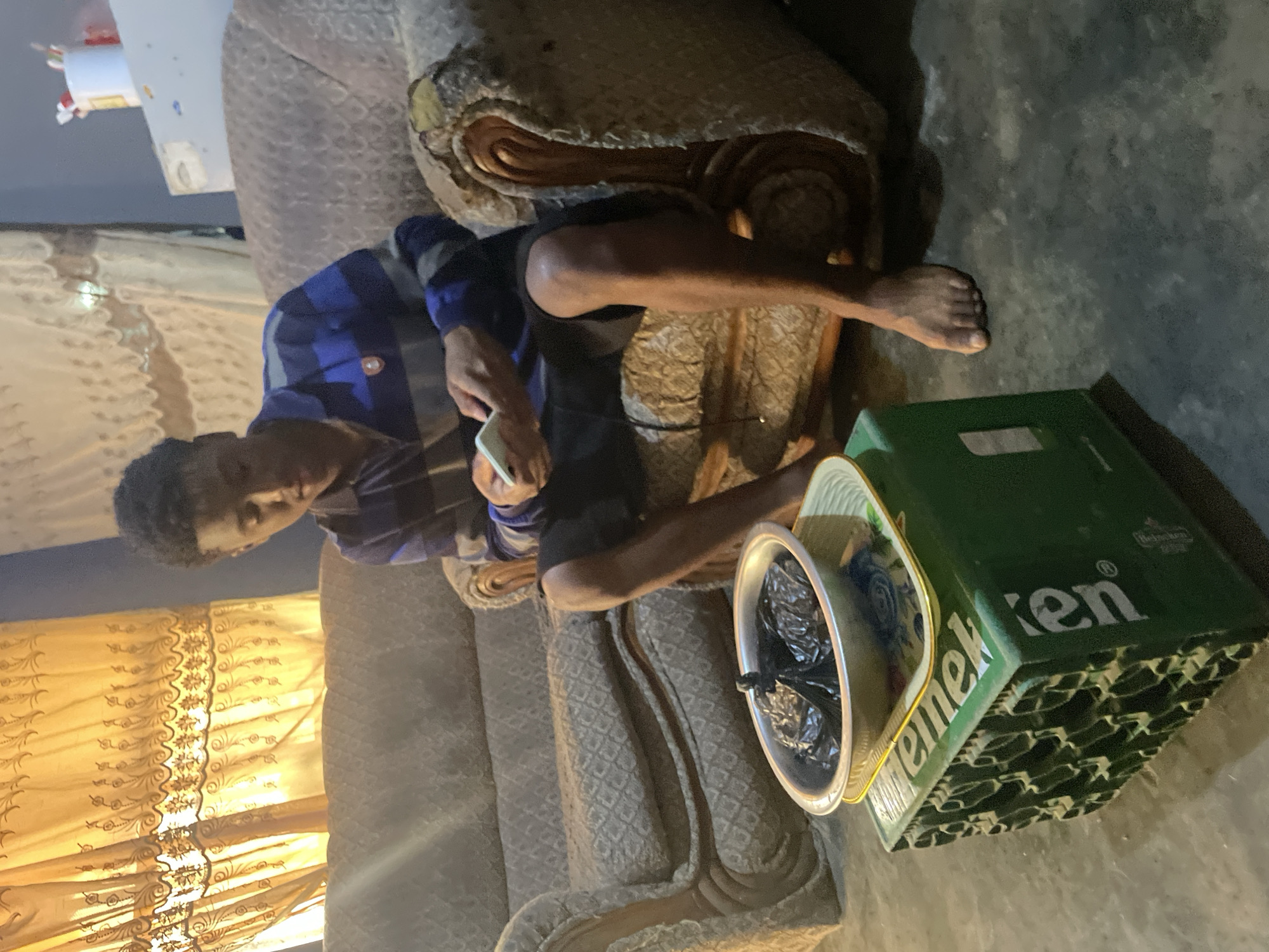 Morning scenes from Jos: phone user, indoor woman, rickshaw