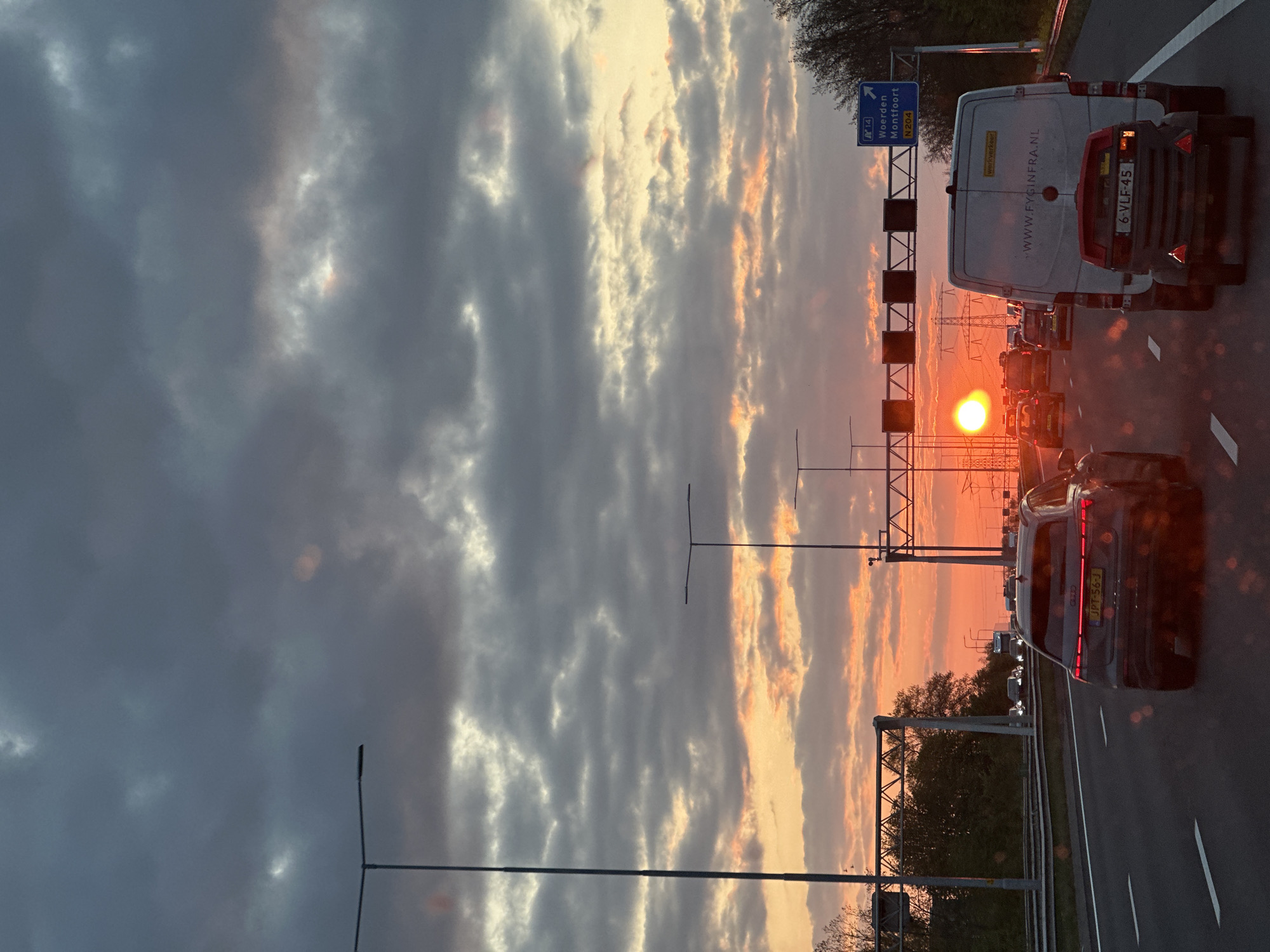 Dramatic sunset observed over congested highway in Woerden