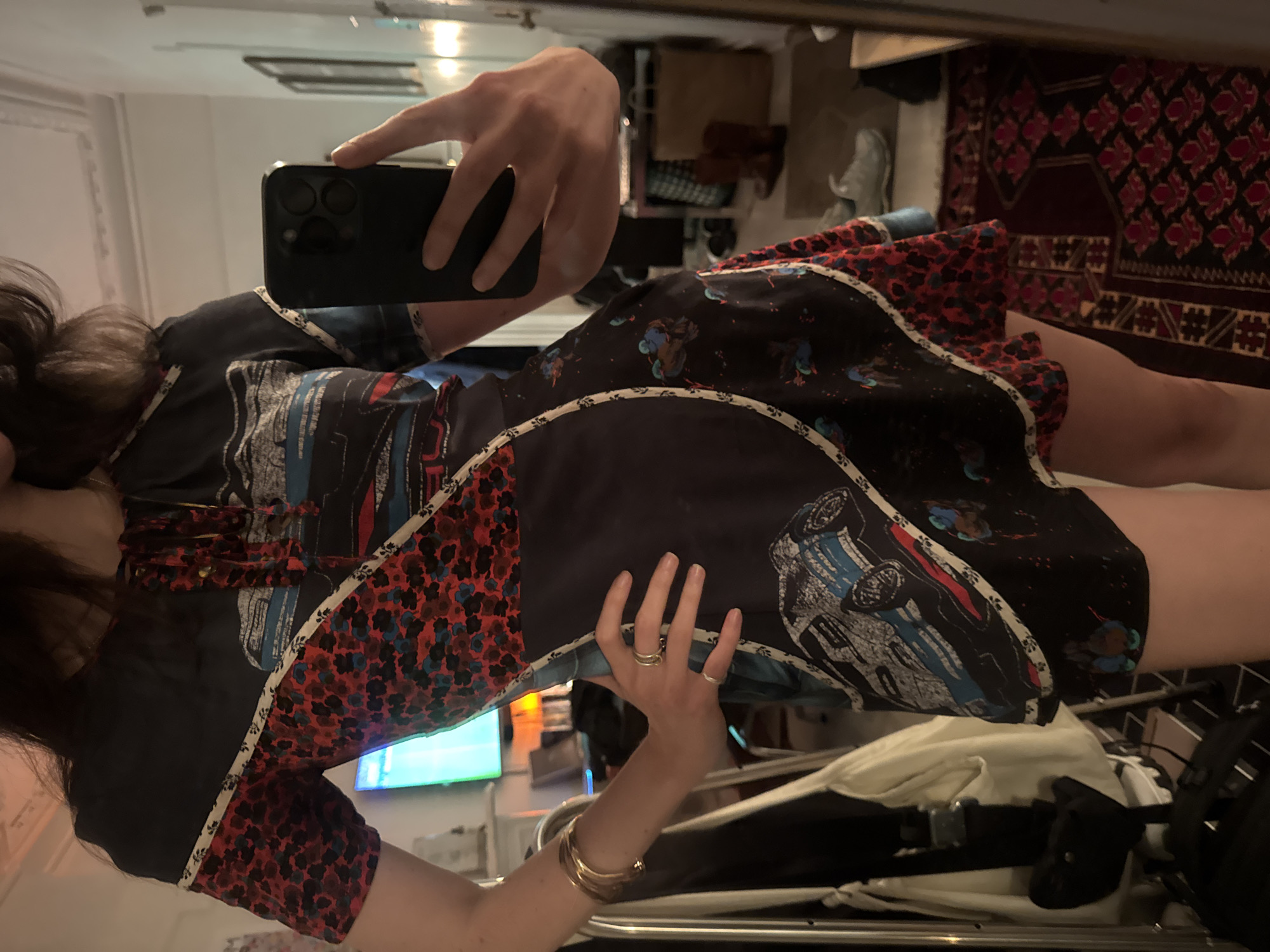 Mirror selfies and an outdoor moment in a patterned black dress