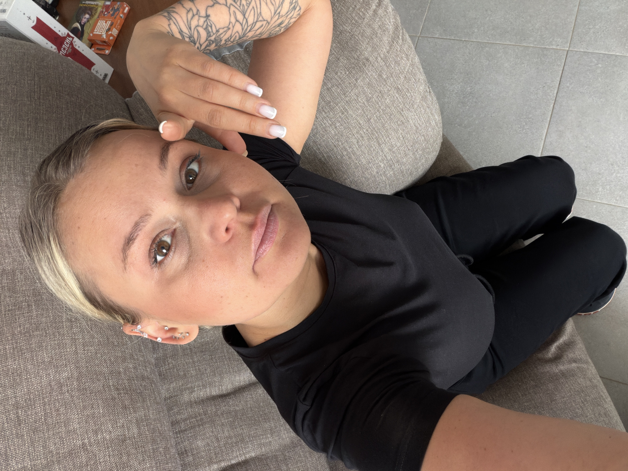 Woman rests on couch in Sarapul, Russia
