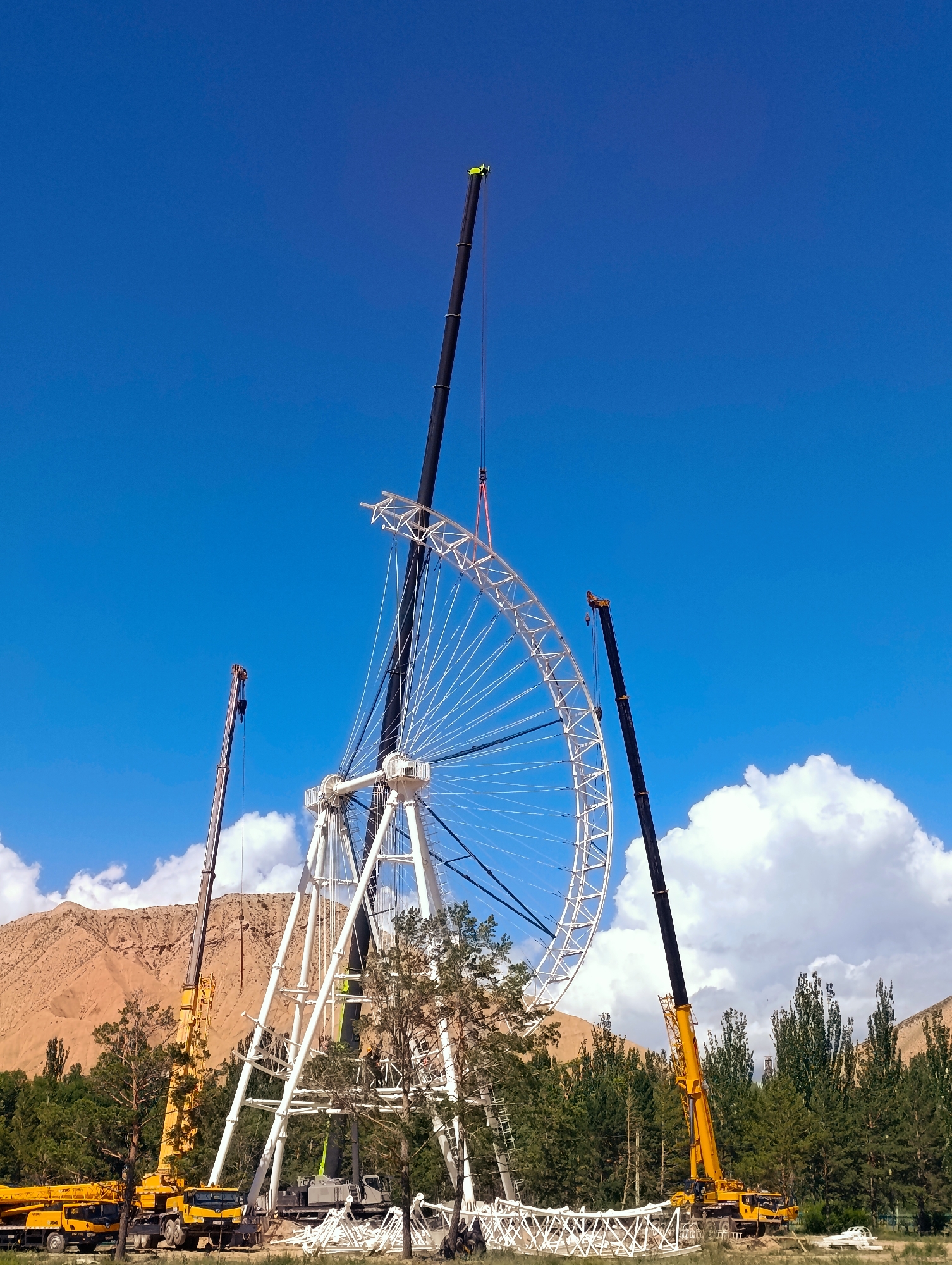 Ferris wheel construction underway in Naryn City, Kyrgyzstan
