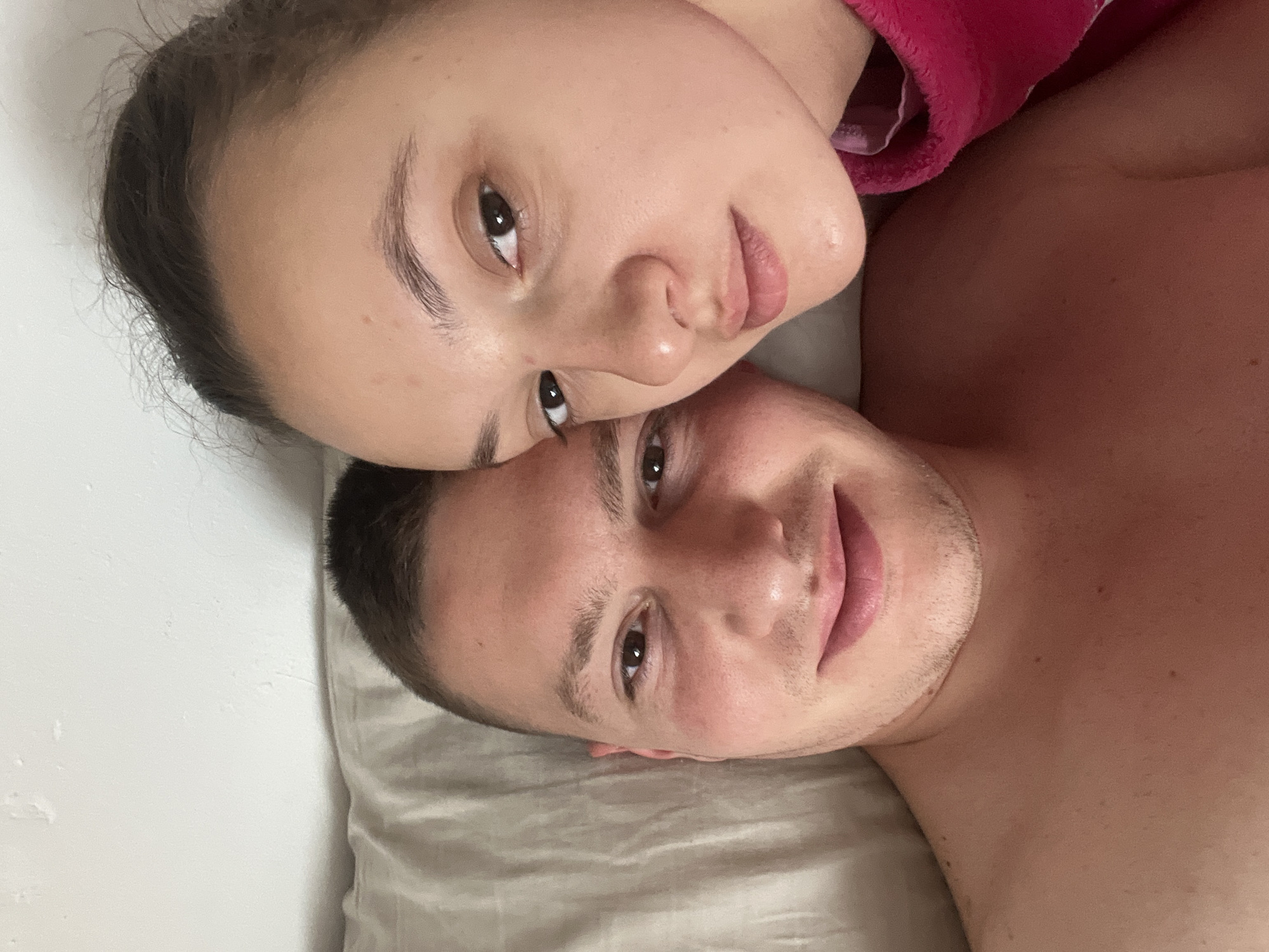 Couple photographed on bed in Saarbrücken morning scene