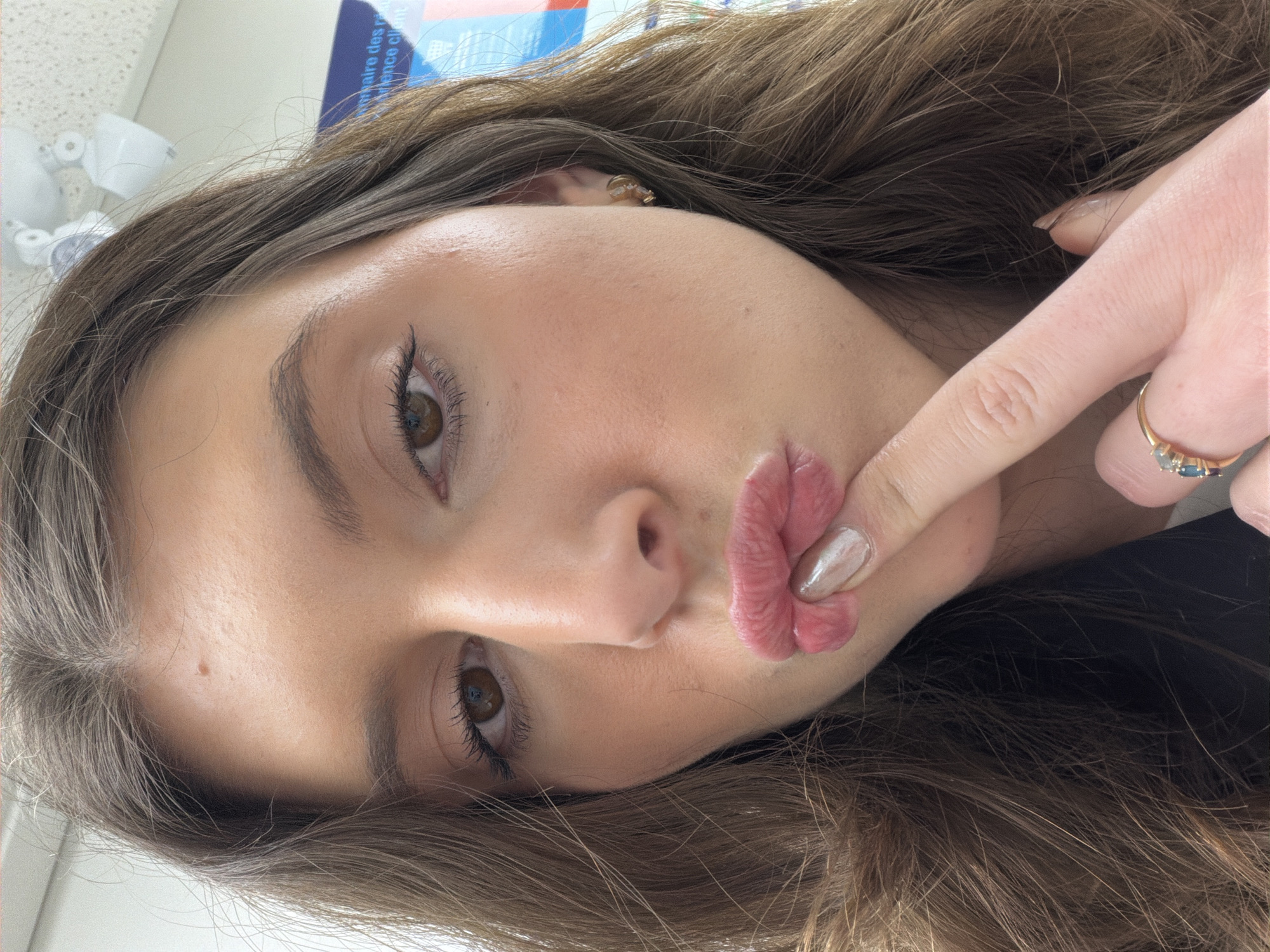 Woman takes selfie with duck face pose in Longueuil