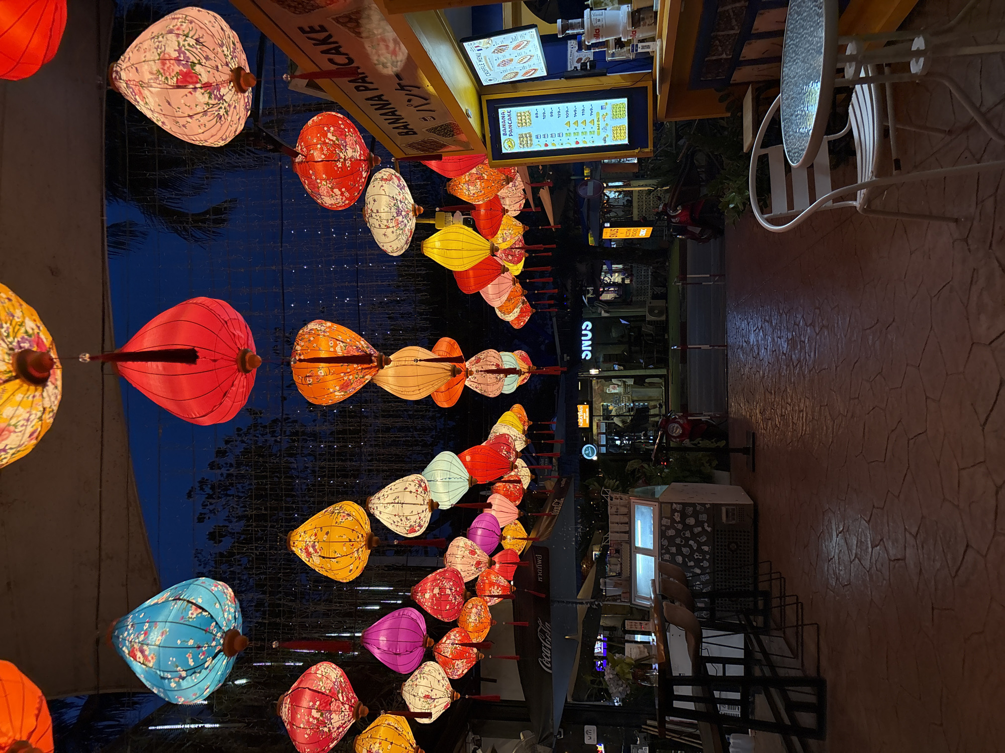 Porto de Phuket glows at dusk under hundreds of colorful lanterns